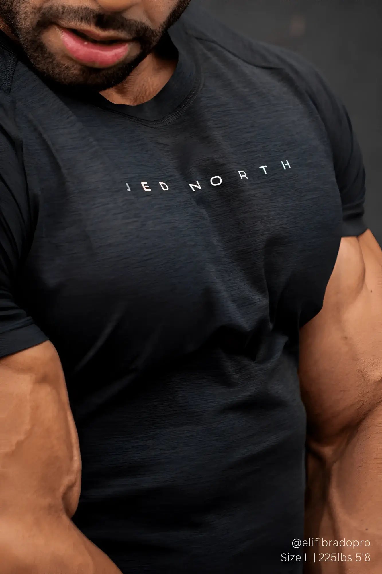Black heathered Jed North agile short sleeve training tee with subtle white logo printed on the chest in charcoal black
