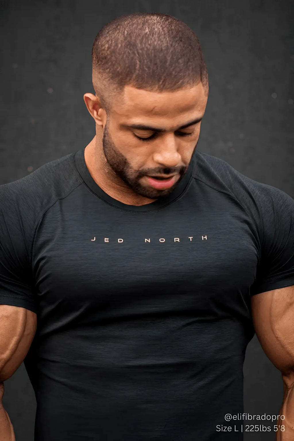 Black short-sleeved athletic t-shirt with jed north logo in white for training in charcoal black color