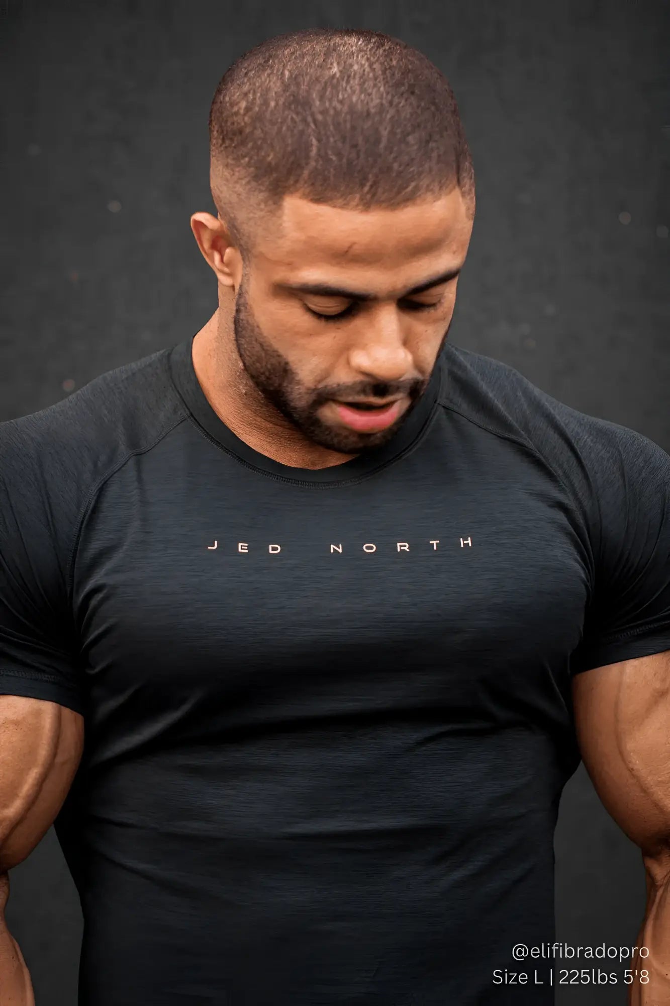 Black short-sleeved athletic t-shirt with jed north logo in white for training in charcoal black color
