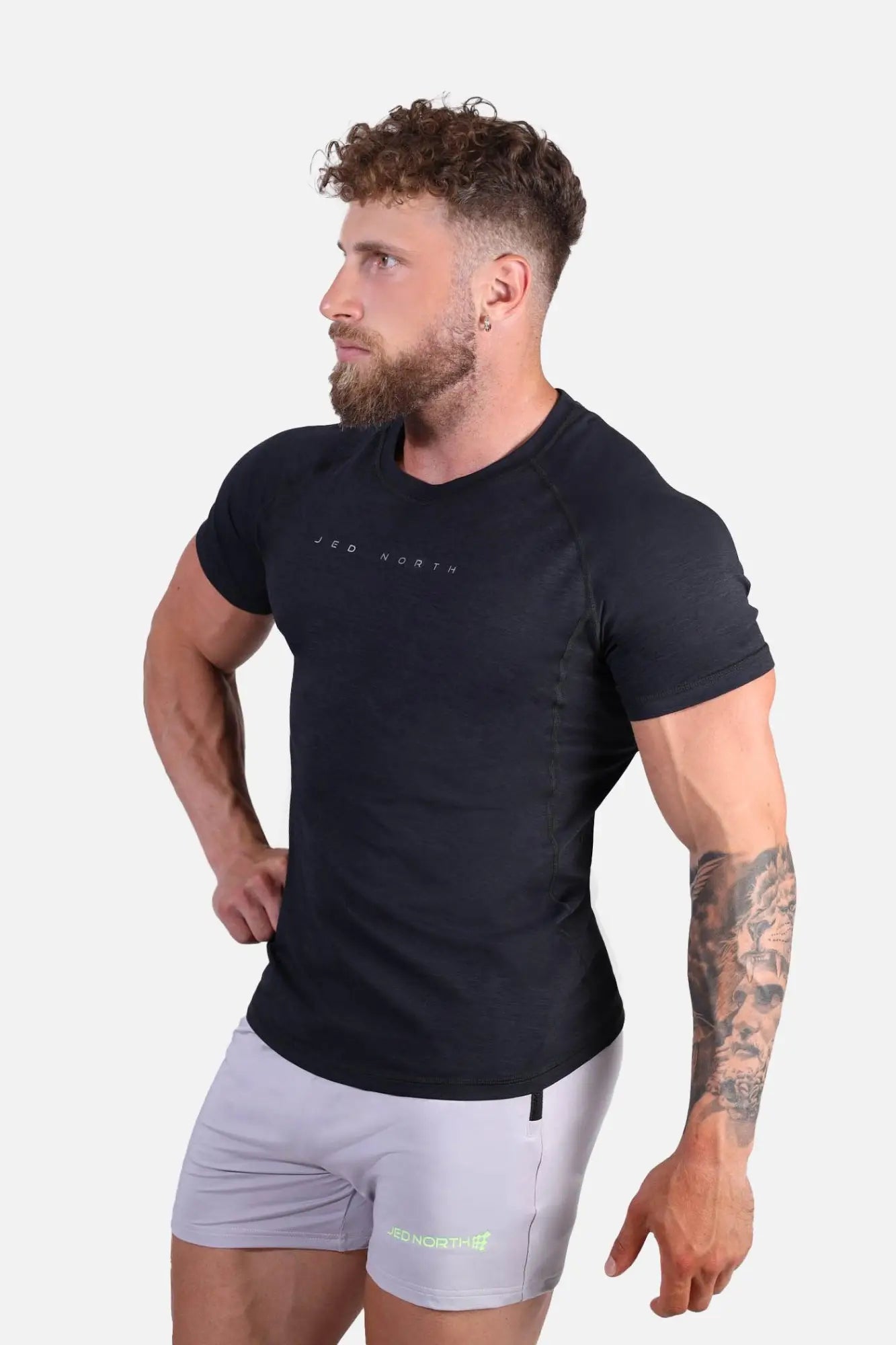 Black short-sleeved jed north agile training tee with subtle white branding across the chest in charcoal black