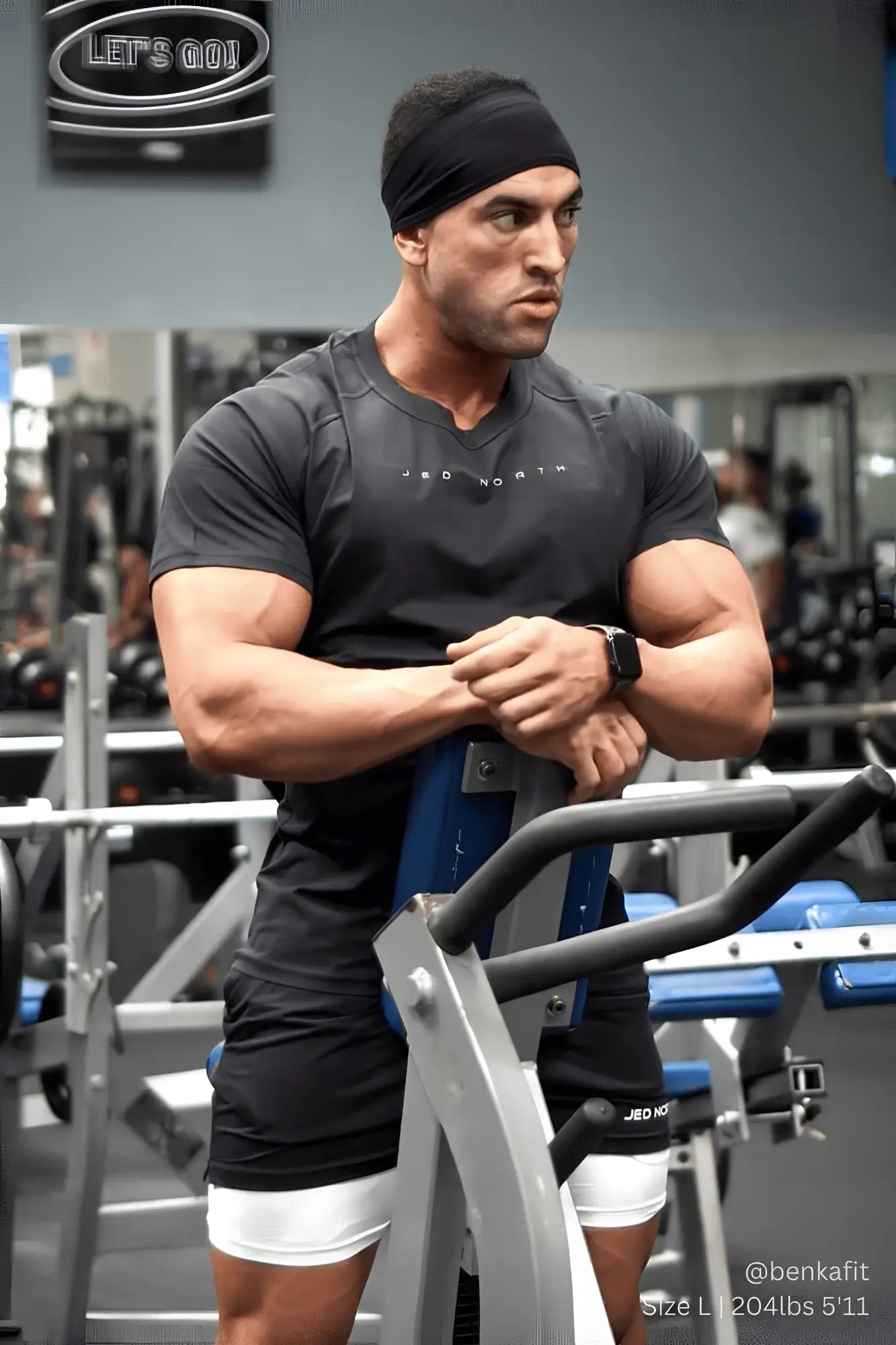 Black smartwatch with sleek minimalist design worn on man’s left wrist paired with Jed North Agile charcoal training tee