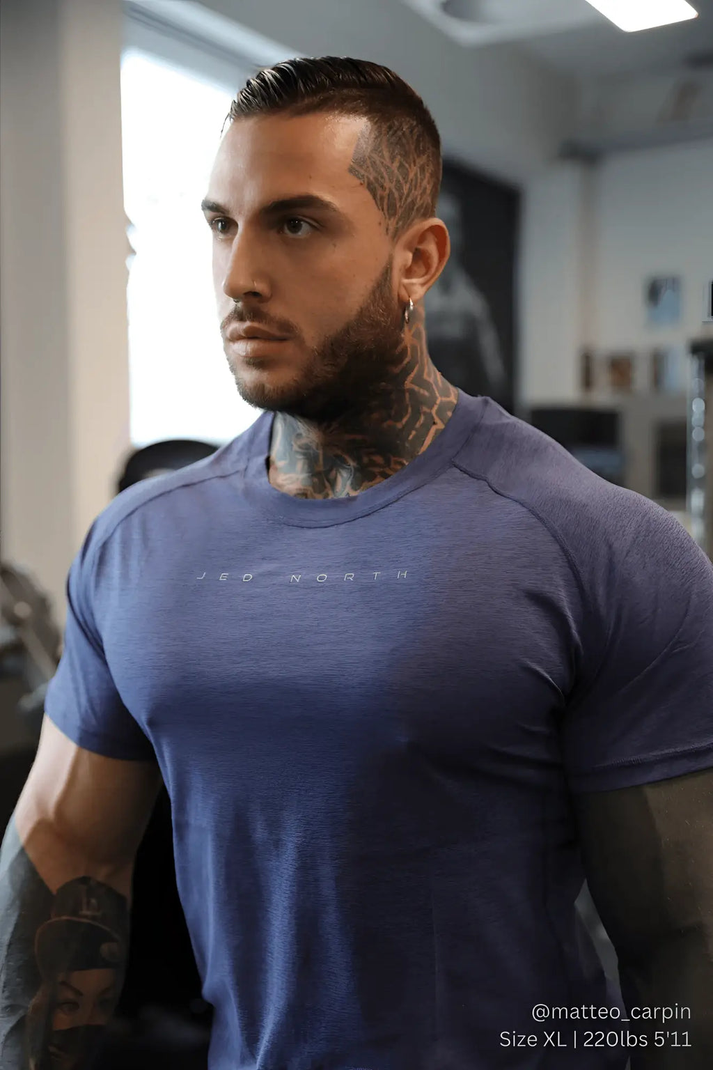 Agile short sleeve training tee in steel blue heather with subtle neo north logo across the chest