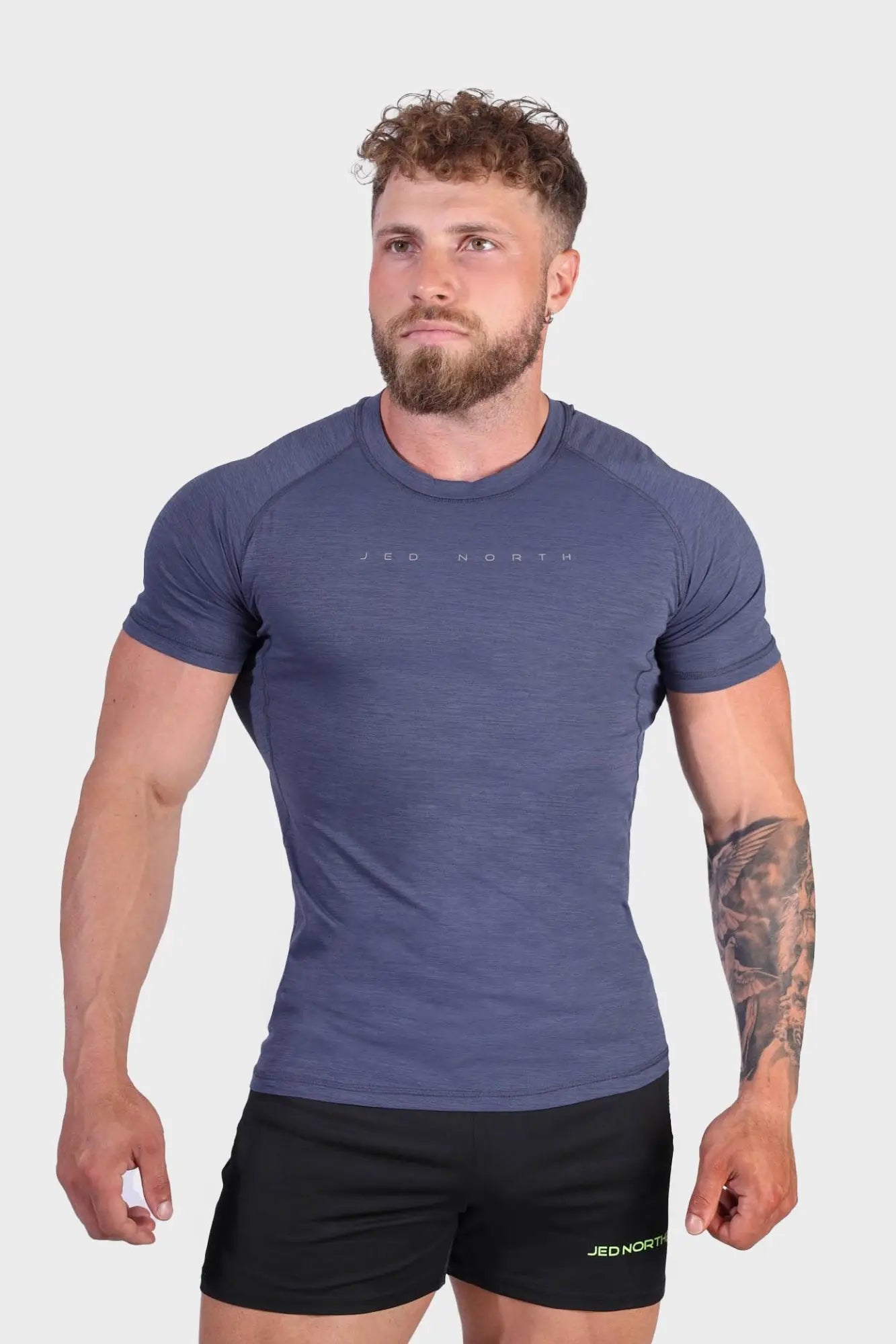A navy blue agile short sleeve training tee with subtle textured fabric and jed north logo on the chest