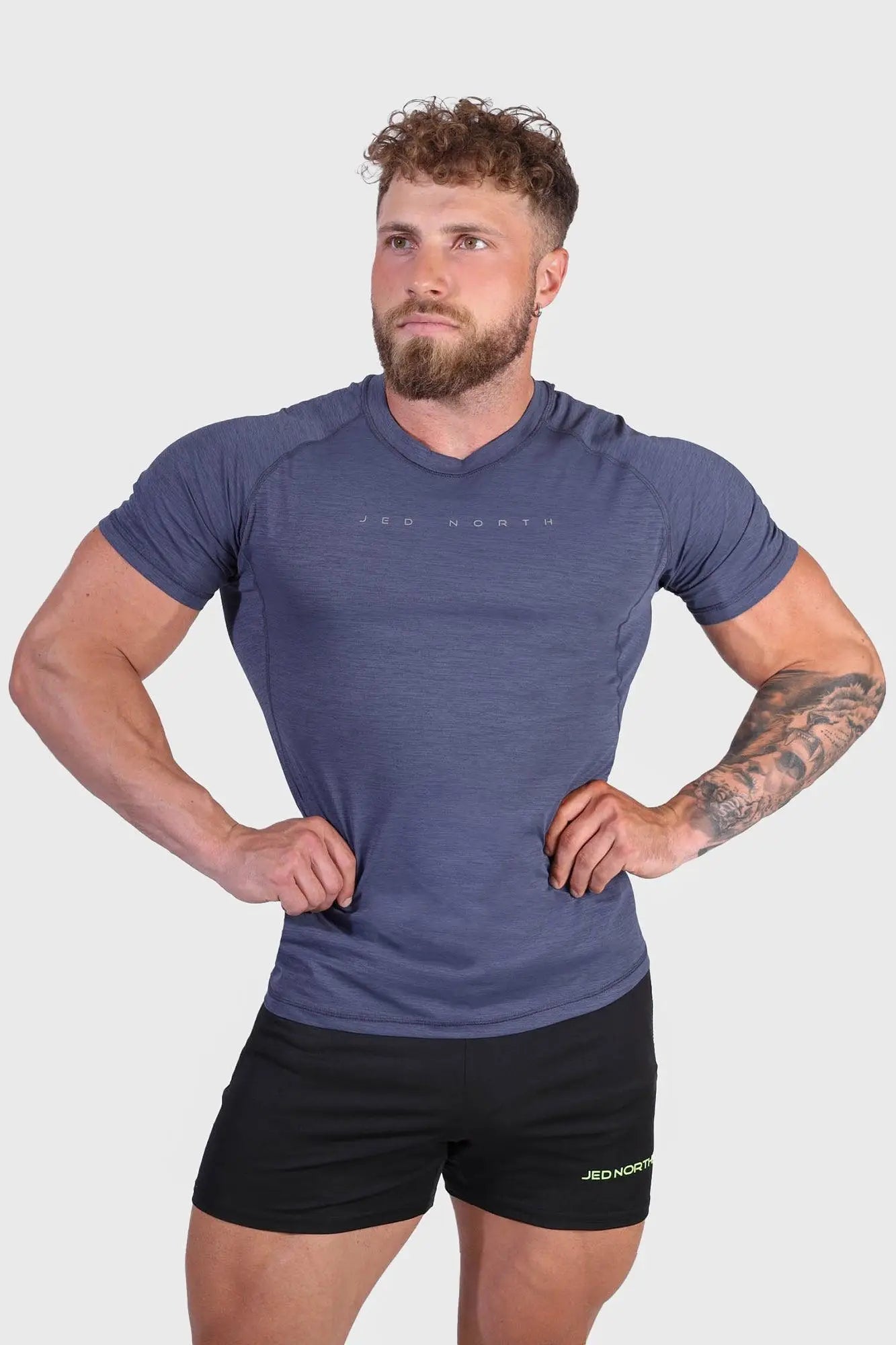 Agile short sleeve training tee in steel blue with textured fabric and red north logo on the chest
