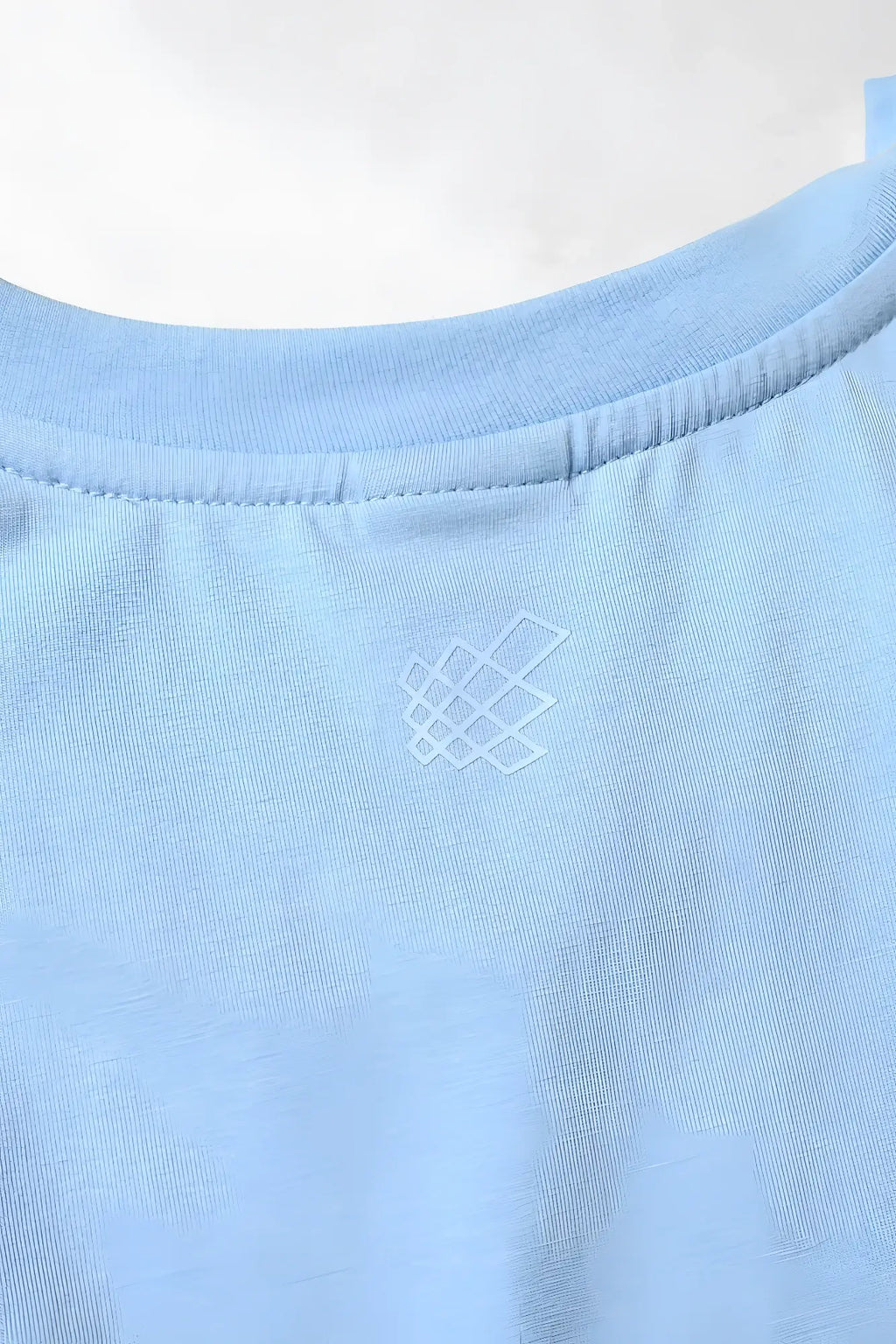 Apollo men’s sleeveless training tee in light blue cotton with a subtle white geometric logo embroidered near the neckline