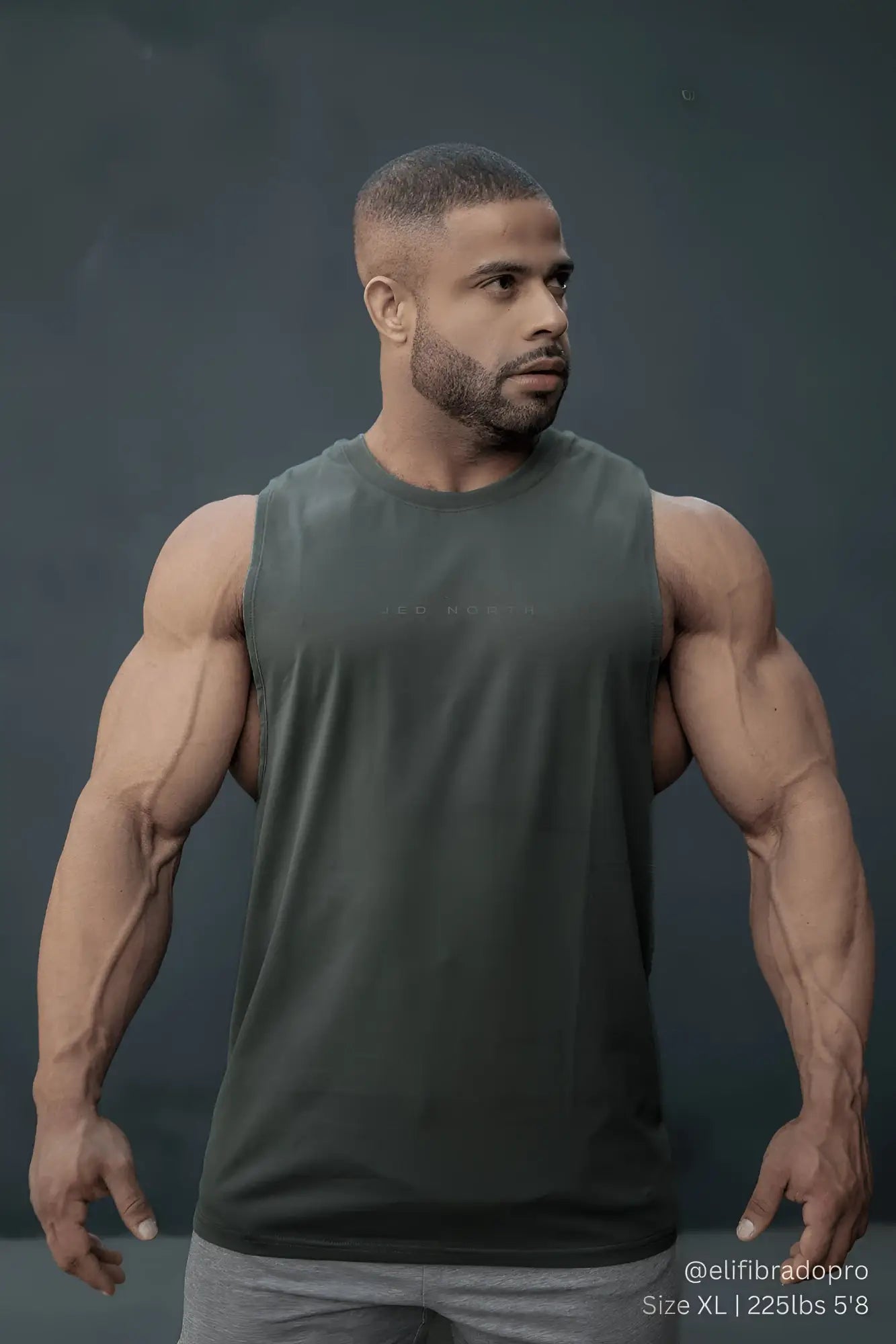 Apollo men’s sleeveless training tee in moss green with a crew neckline and subtle texture for athletic use