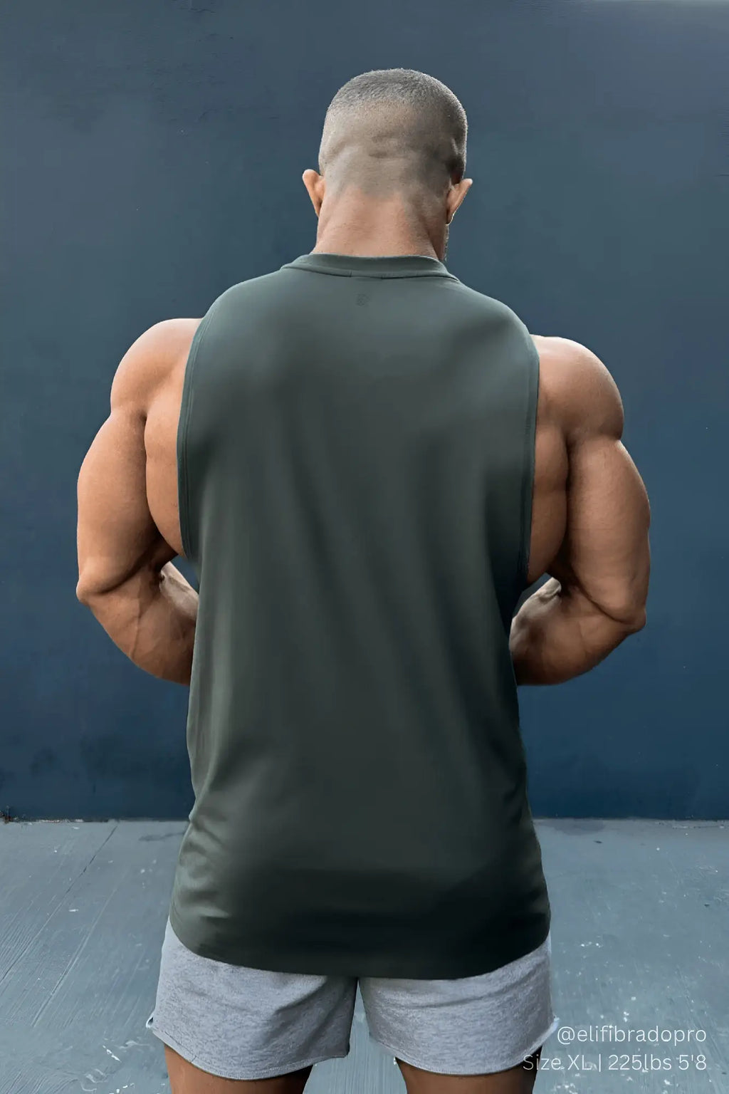Apollo men’s sleeveless training tee in moss green made of breathable fabric for athletic workouts