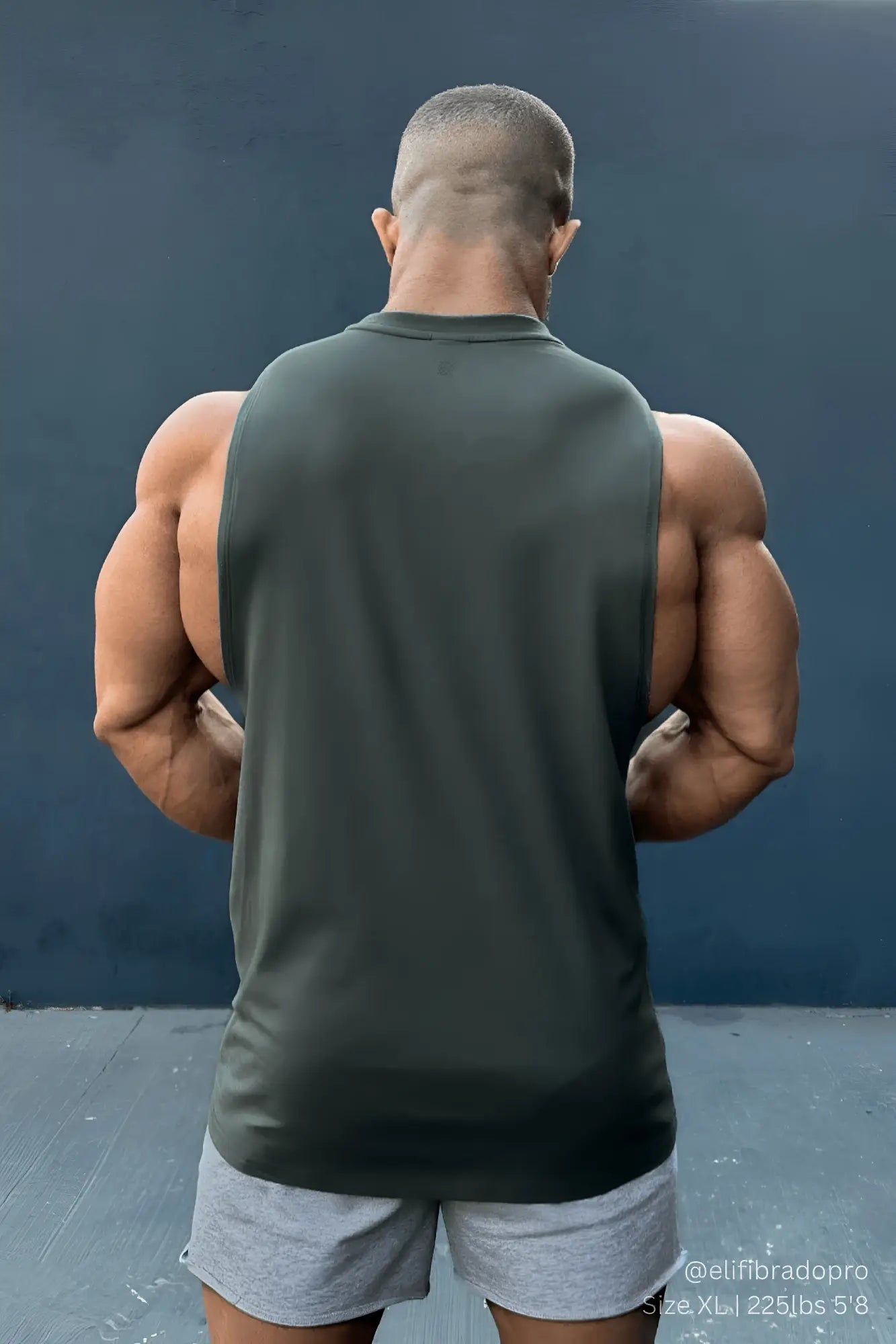 Apollo men’s sleeveless training tee in moss green made of breathable fabric for athletic workouts
