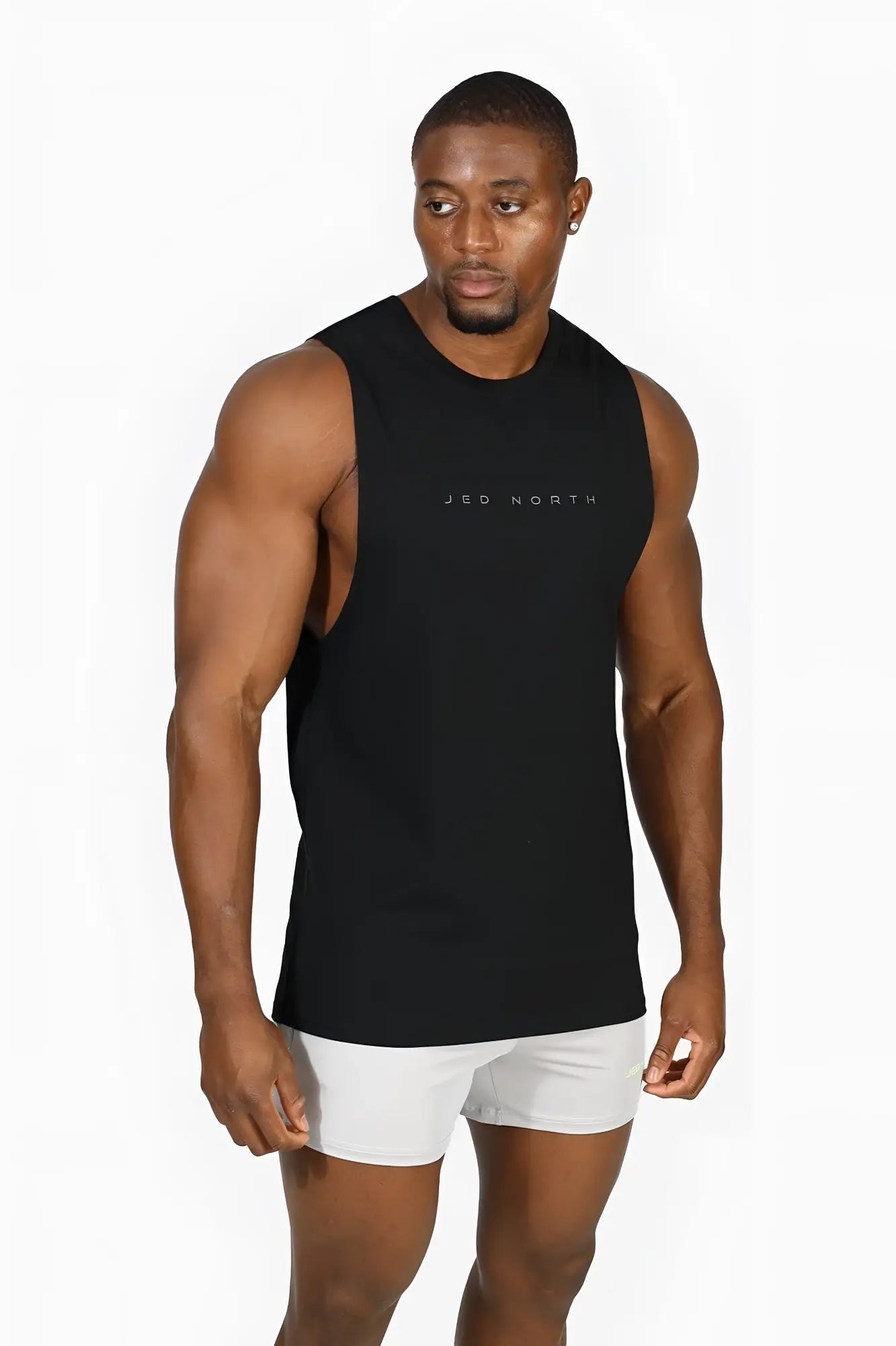 Jed north apollo men’s sleeveless training tee in obsidian black featuring a subtle logo across the chest