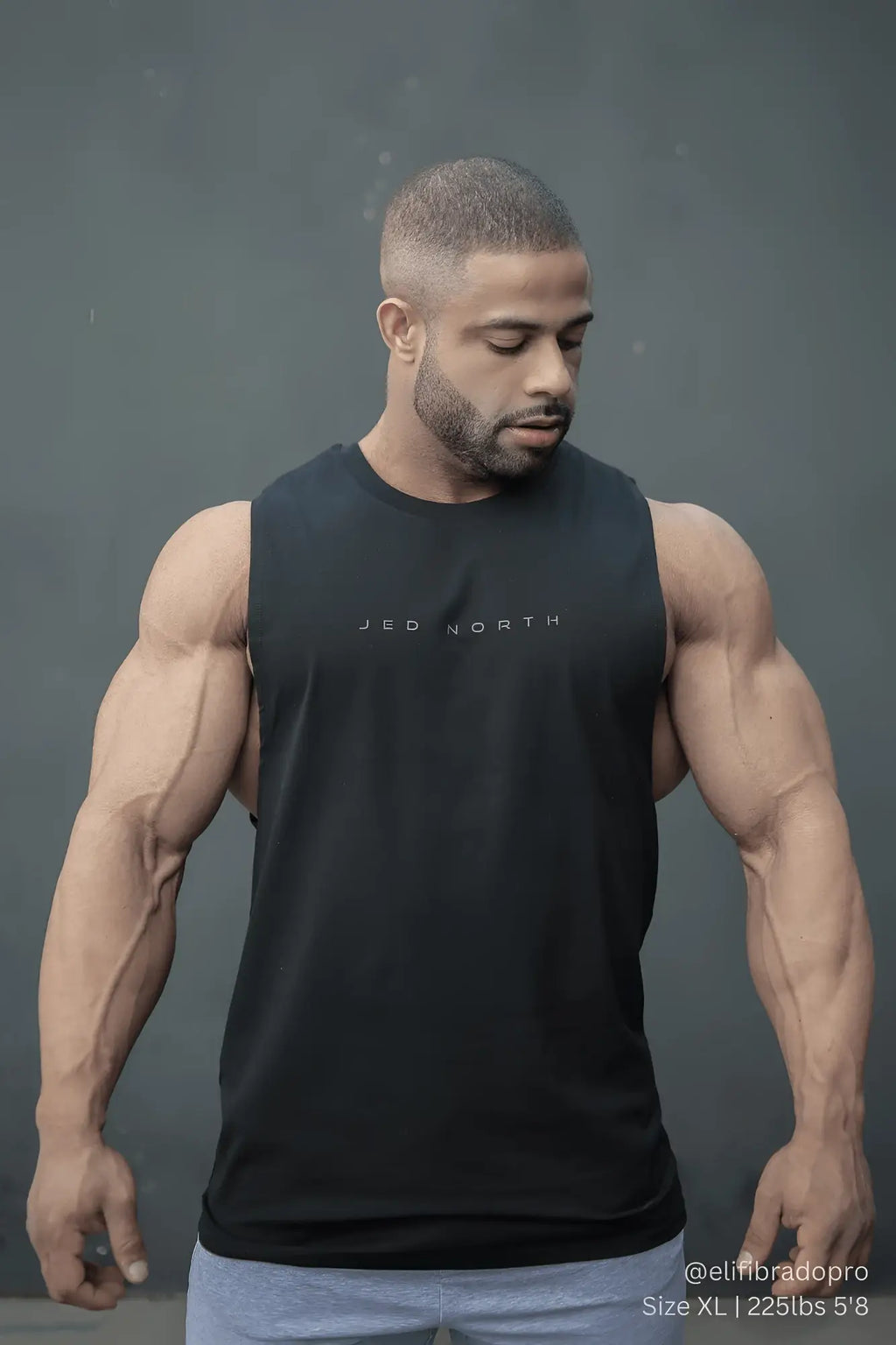 Black sleeveless athletic tank top with jed north printed in white for men ideal for training and workouts