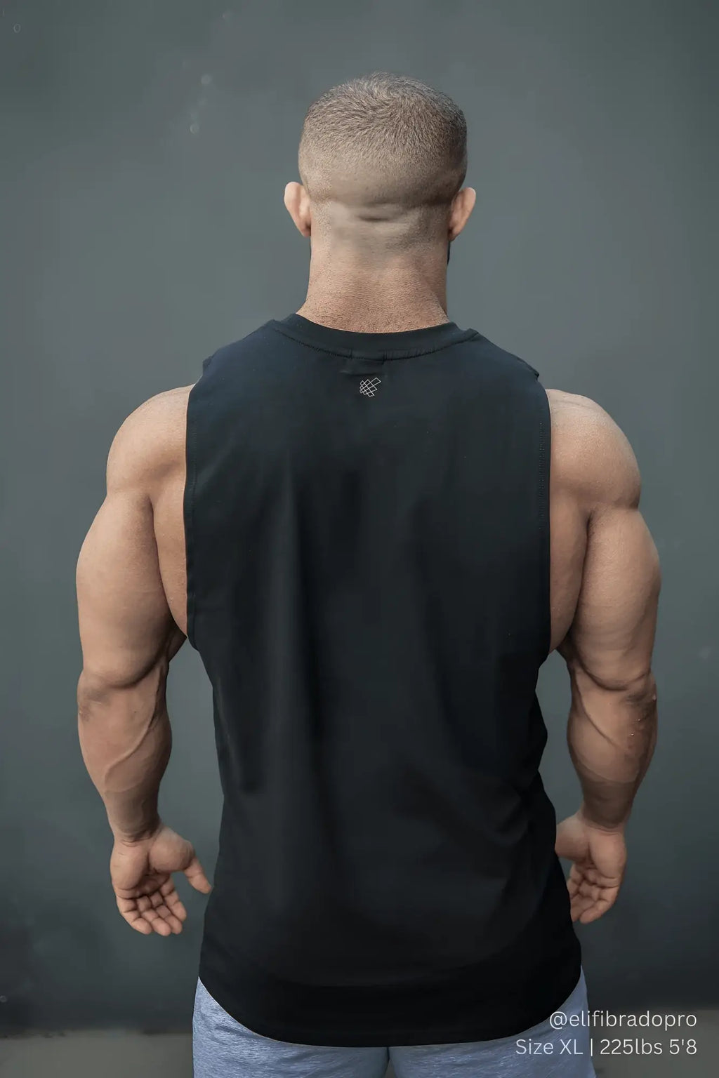 Jed north apollo men’s sleeveless training tee in obsidian black with a subtle logo at the neckline designed for workouts