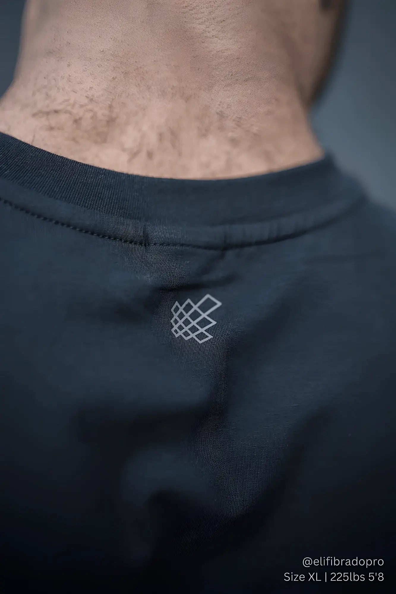 Jed North Apollo men’s sleeveless training tee in obsidian black cotton with a subtle white geometric logo near the neckline