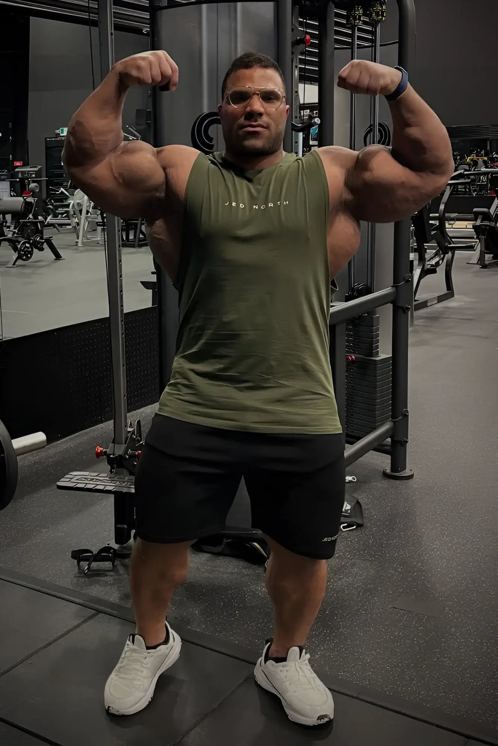 Olive green sleeveless training tank top with jed north logo across the chest for men
