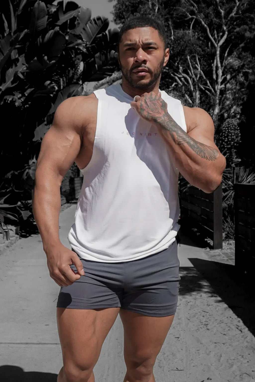 White sleeveless athletic tank top with small chest logo made for training by Jed North Apollo men’s sleeveless tee
