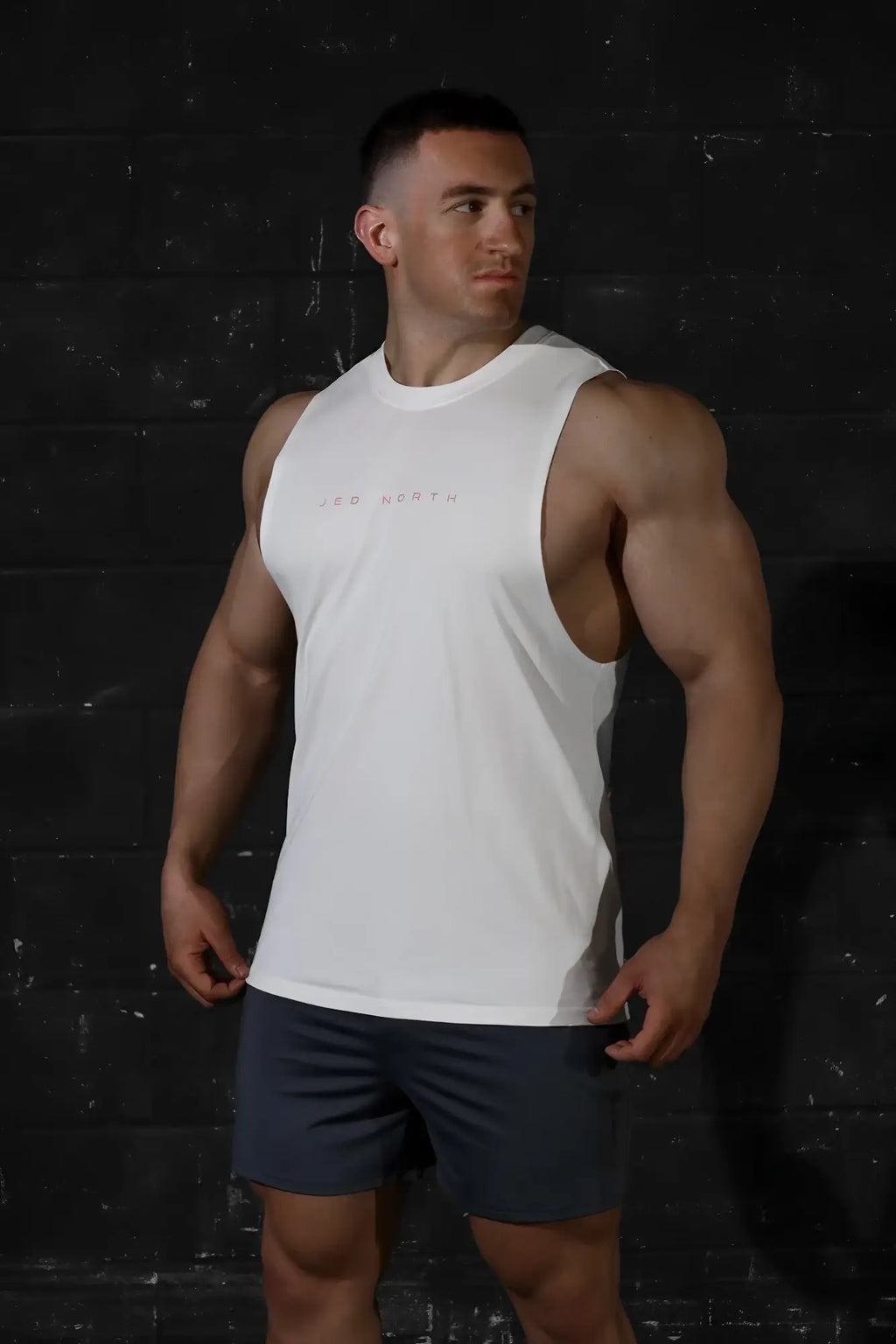 Jed North Apollo men’s sleeveless training tee in white with a subtle chest logo for athletic workouts