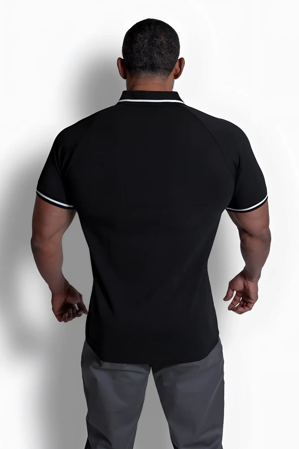 Black banded muscle-fit polo t-shirt with white collar and sleeve trim in short-sleeved breathable fabric