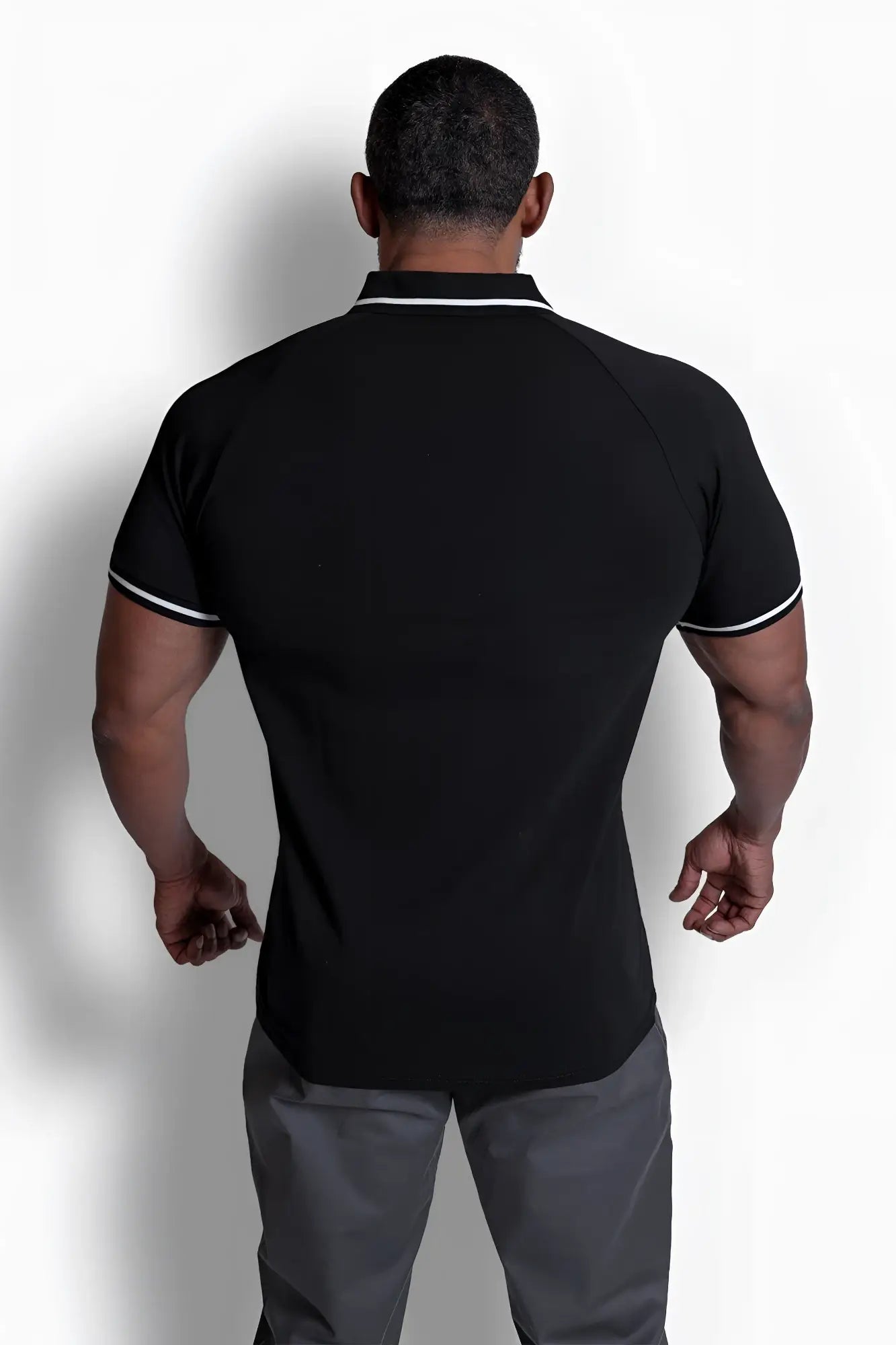 Black banded muscle-fit polo t-shirt with white collar and sleeve trim in short-sleeved breathable fabric