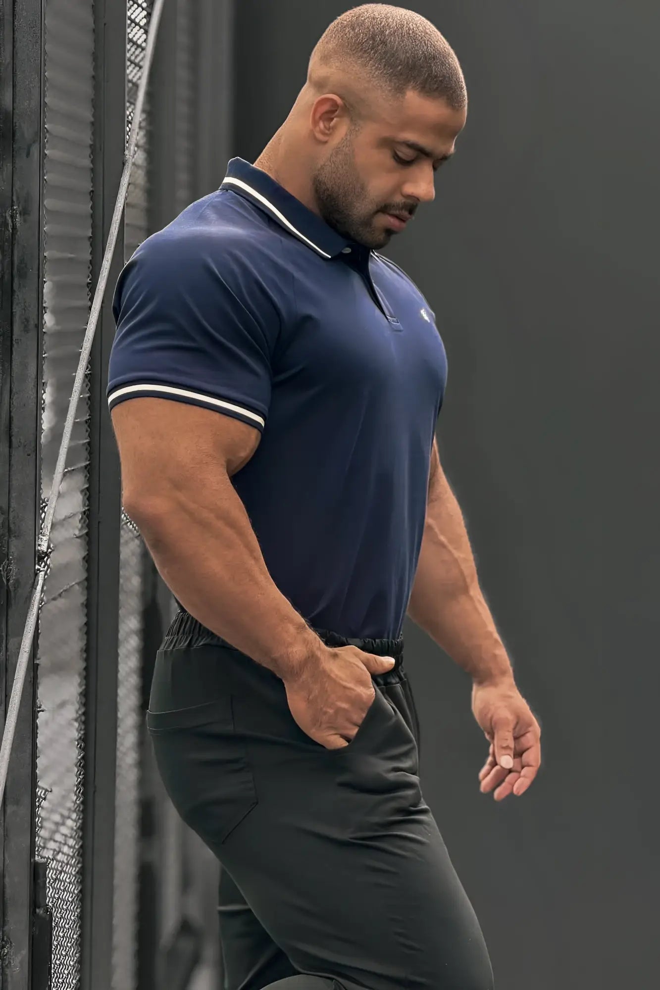 Navy banded muscle-fit polo t-shirt with white trim on collar and sleeve cuffs in breathable fabric