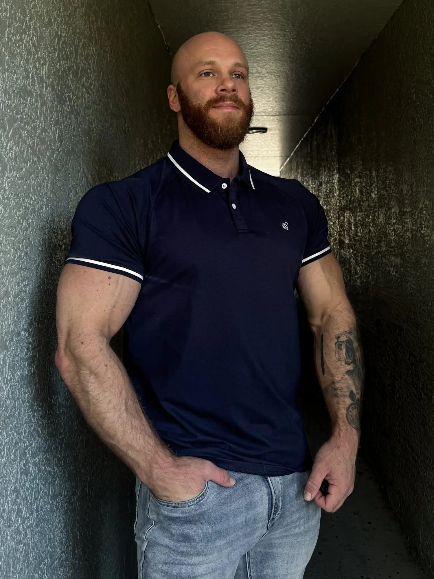 Navy banded muscle-fit polo t-shirt with white collar and sleeve trim, designed for a tailored athletic look