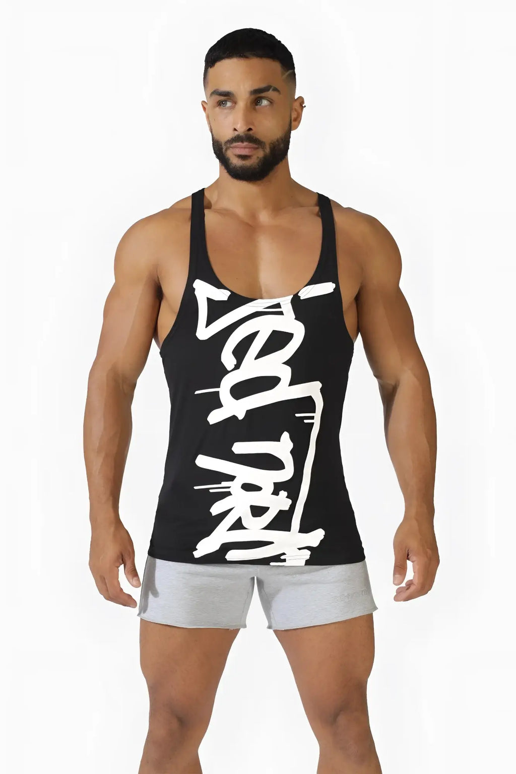 Classic bodybuilding racerback stringer tank top in black with bold white brushstroke logo across the front