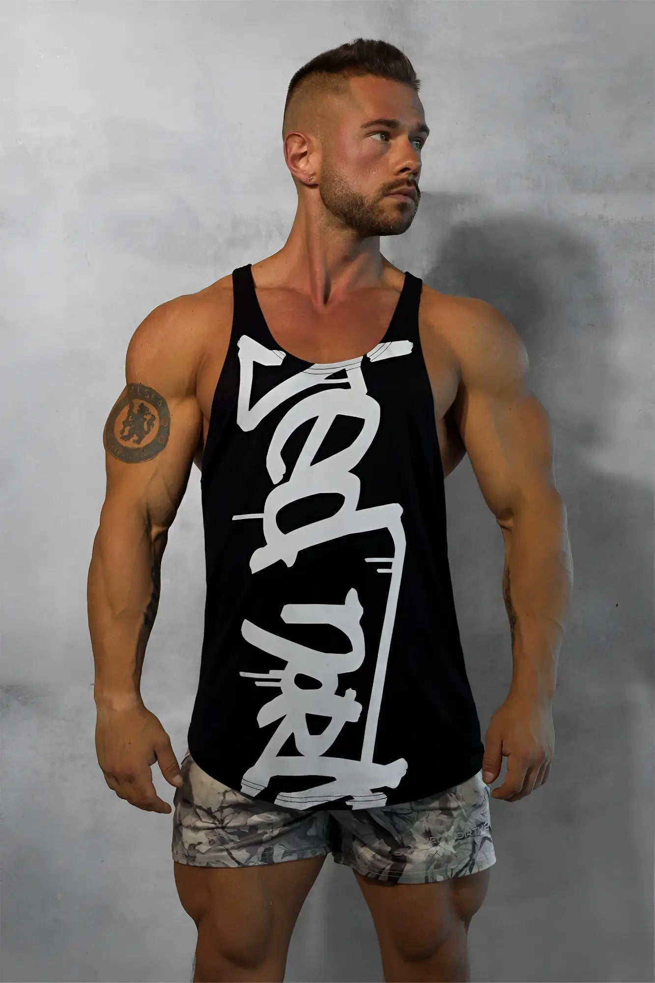 Black classic bodybuilding racerback stringer tank top with bold white graffiti style logo on the front
