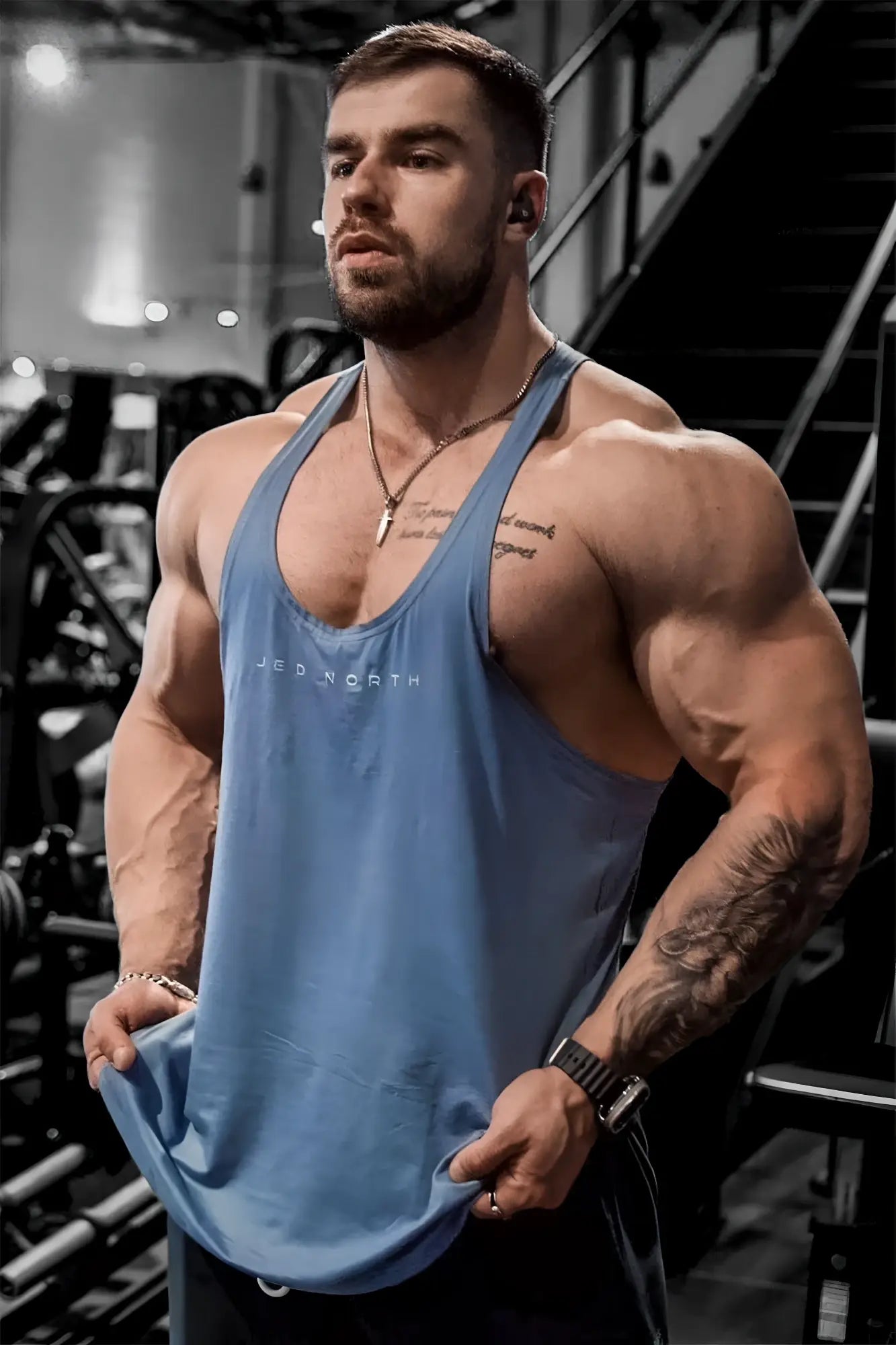Blue sleeveless tank top made of breathable fabric with jep north print for bodybuilding and gym use by Jed North