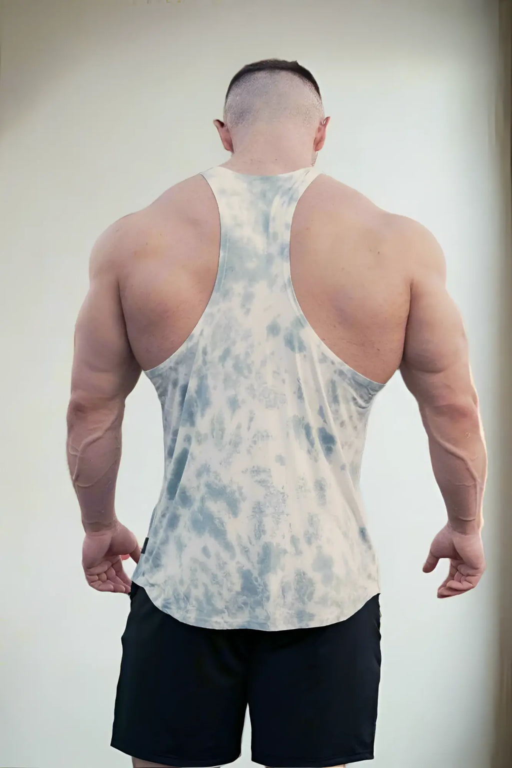 Jed North classic bodybuilding racerback stringer is a fitted sleeveless tank top in light blue and white tie dye soft fabric