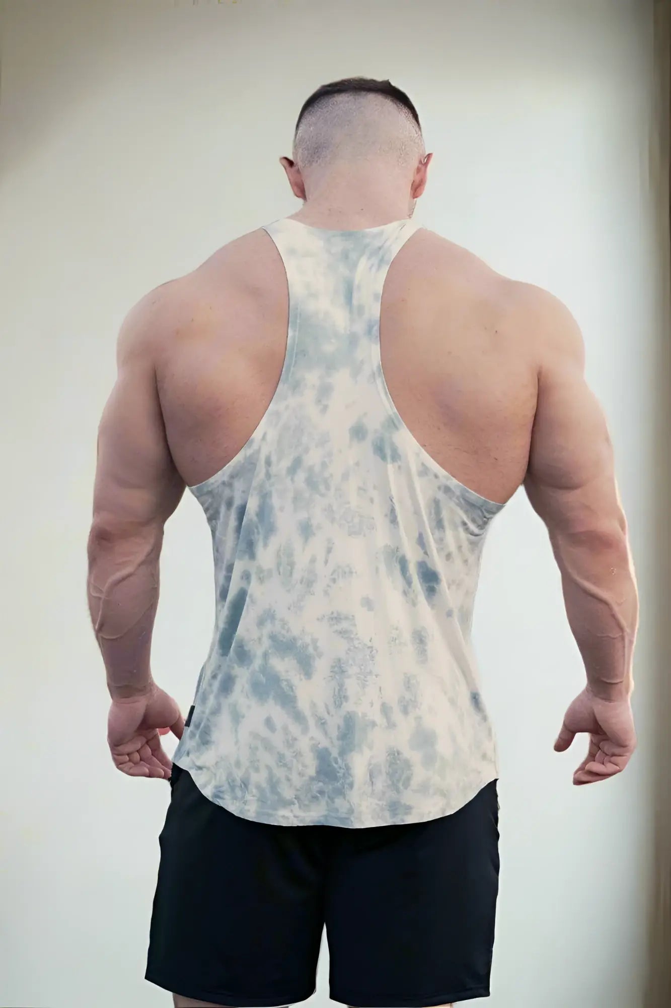 Jed North classic bodybuilding racerback stringer is a fitted sleeveless tank top in light blue and white tie dye soft fabric
