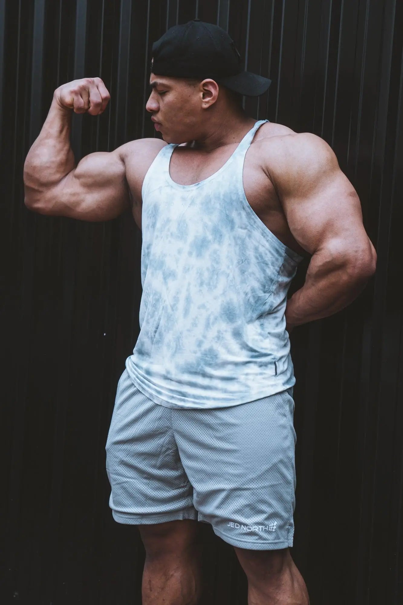 Jed North classic bodybuilding racerback stringer in gray tie dye featuring a light blue tie dye mesh tank top with thin straps
