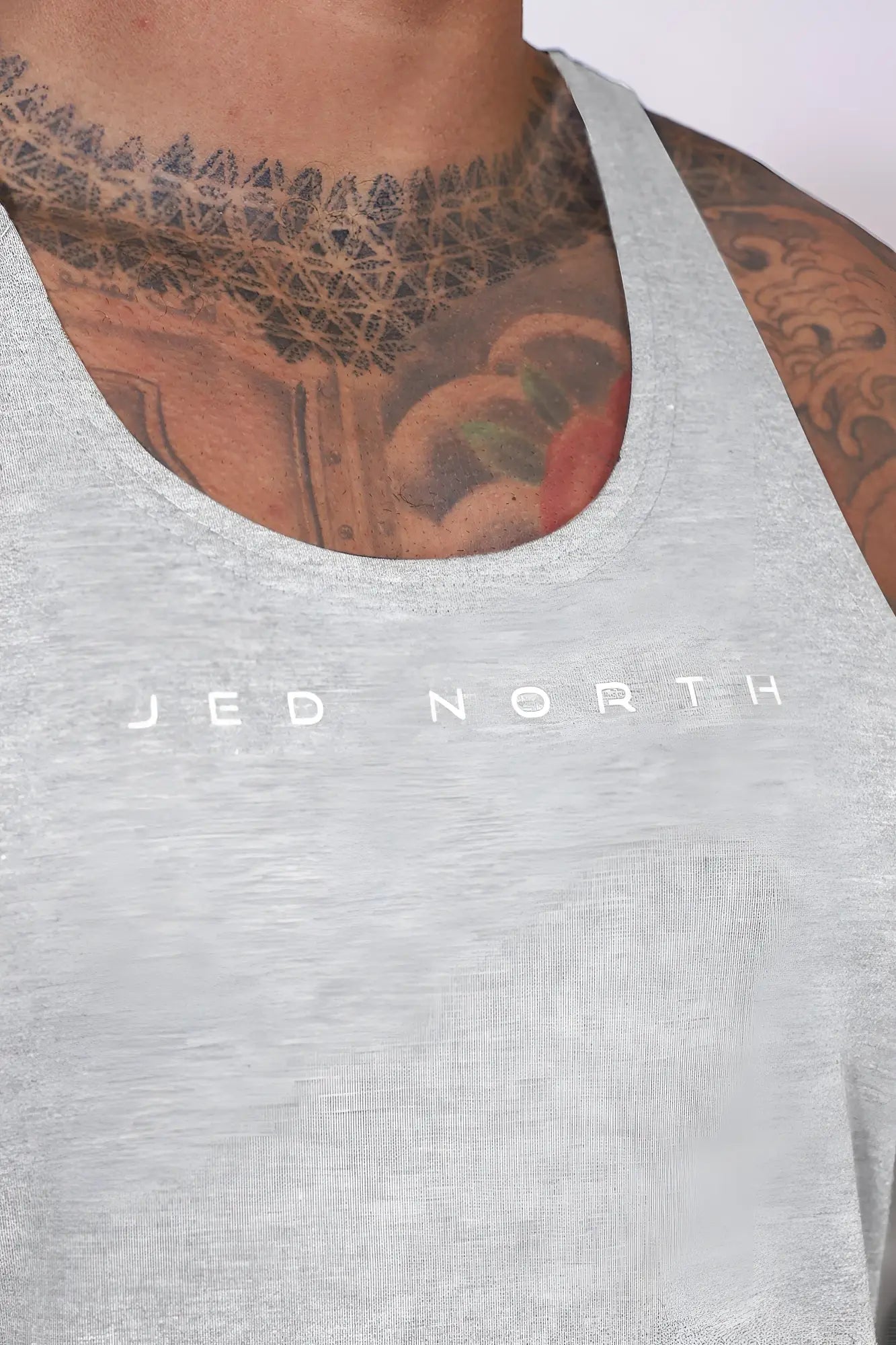 Gray heathered light gray Jed North classic bodybuilding racerback stringer tank top with white logo print across chest
