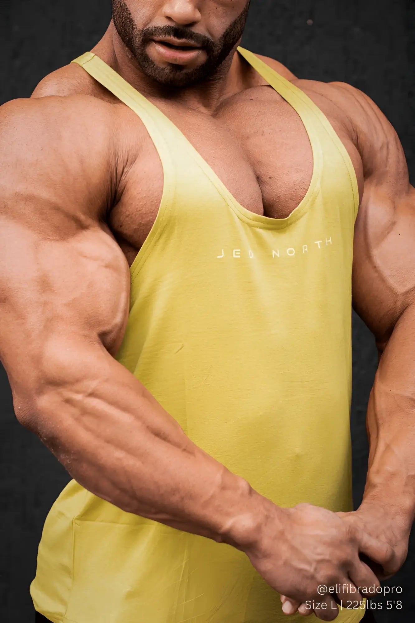 Yellow sleeveless tank top with jel north print on chest from jed north classic bodybuilding racerback stringer mustard yellow