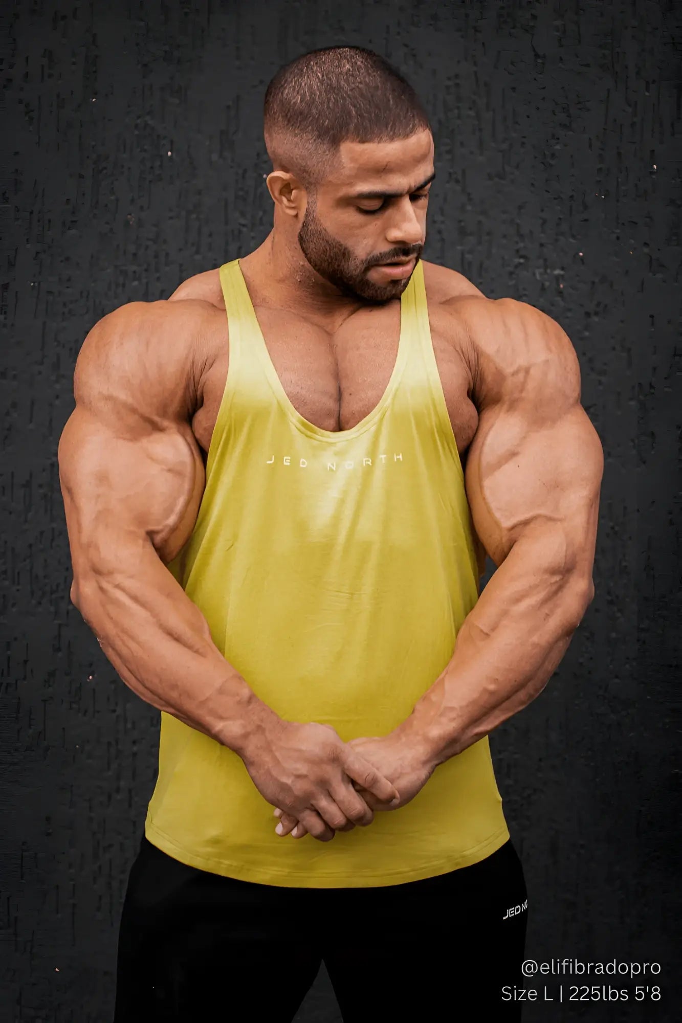 A vibrant mustard yellow jed north classic bodybuilding racerback stringer tank top with a subtle logo across the chest