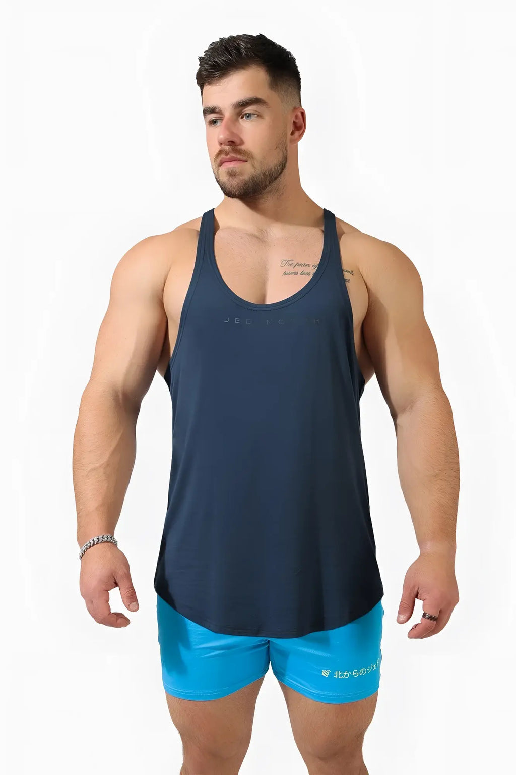 Navy blue sleeveless athletic tank top with racerback design and subtle Jed North logo for bodybuilding