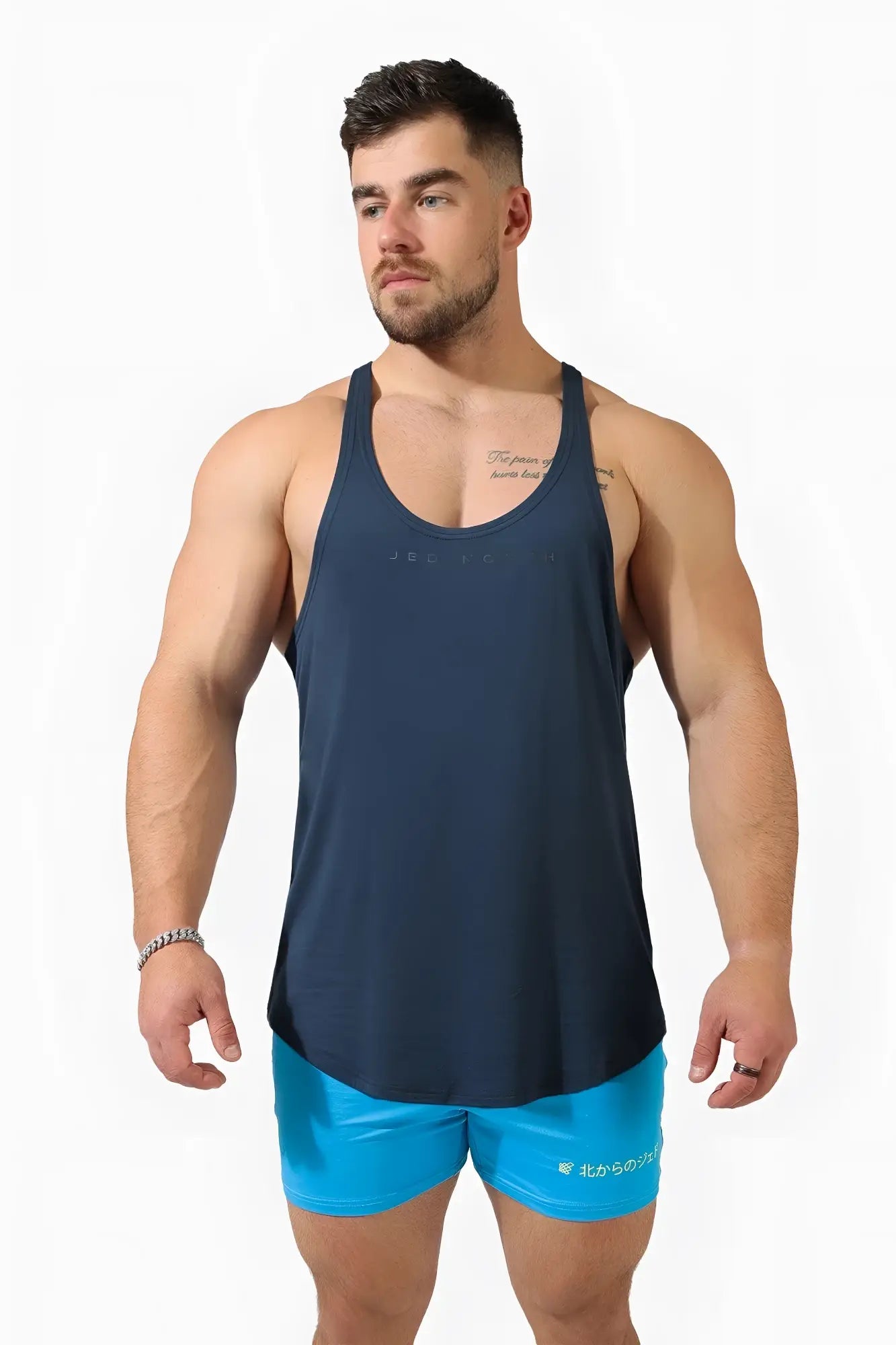 Navy blue sleeveless athletic tank top with racerback design and subtle Jed North logo for bodybuilding