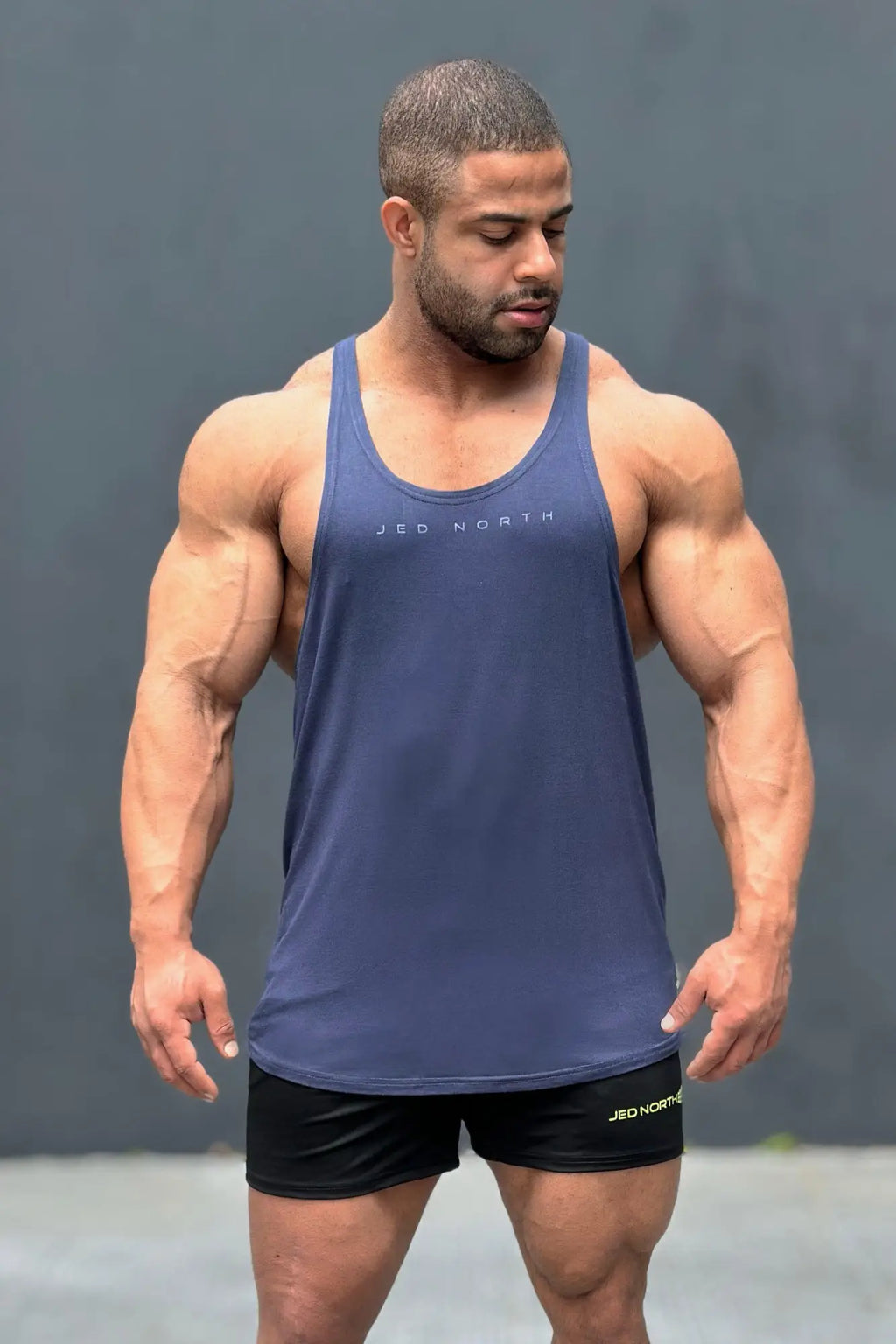 Blue sleeveless jed north classic bodybuilding racerback stringer tank top with branding across the chest