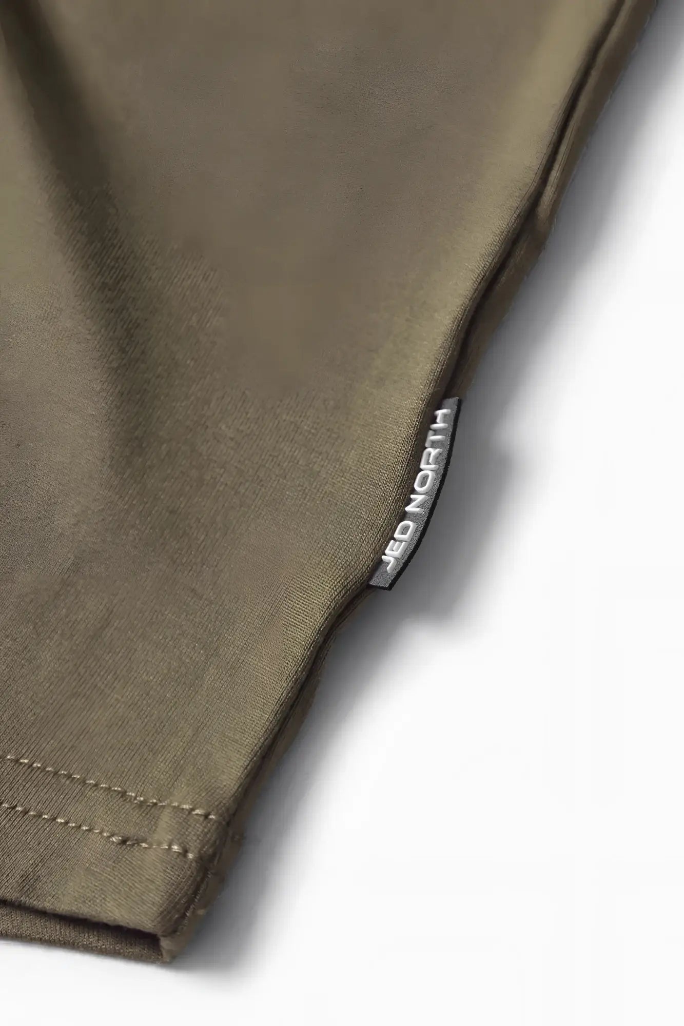 Olive green cotton Jed North classic bodybuilding racerback stringer with silver brand tag sewn into the seam