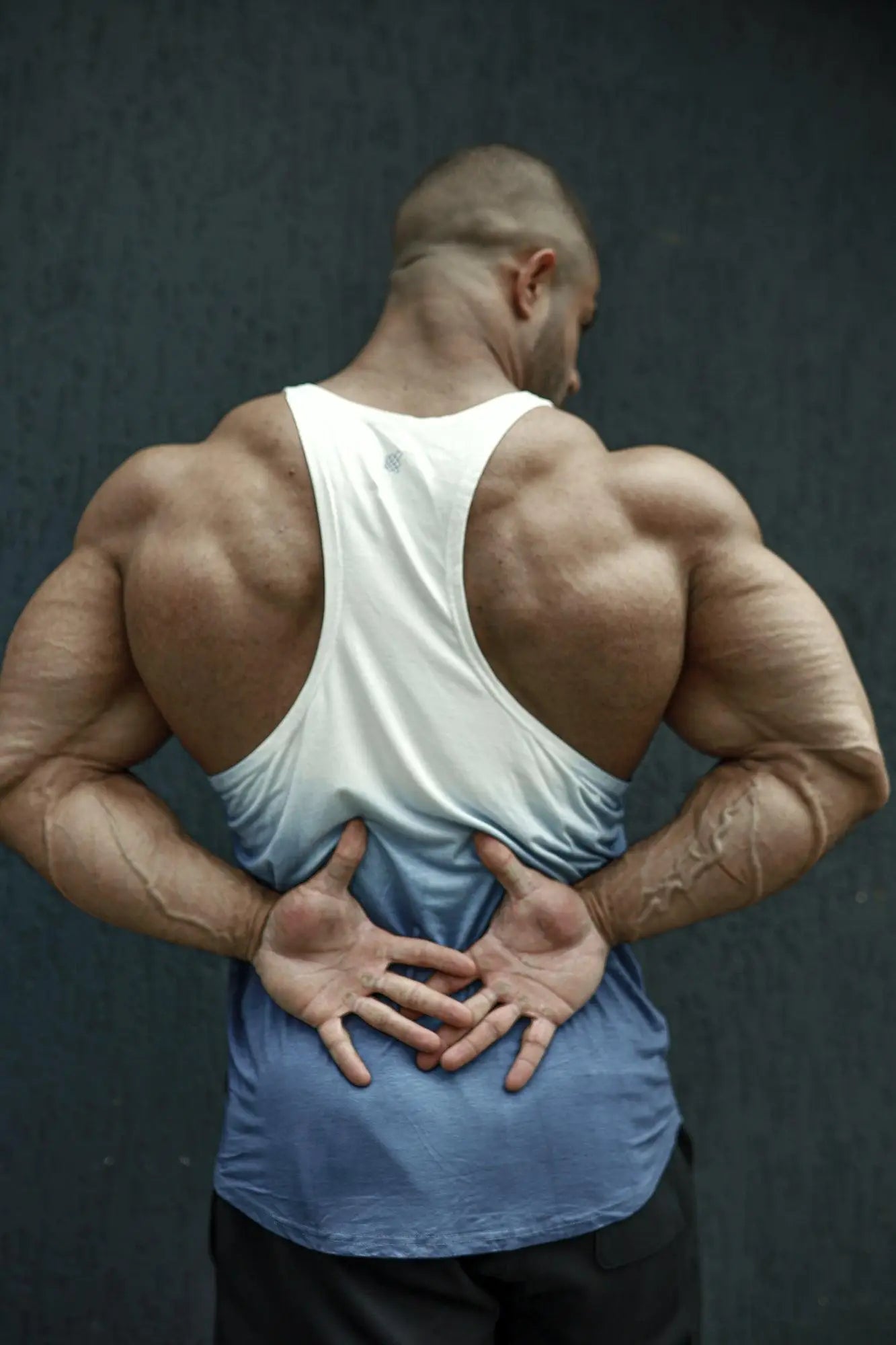 White and blue gradient tank top with racerback design shown from the back in classic bodybuilding racerback stringer ombre blue style