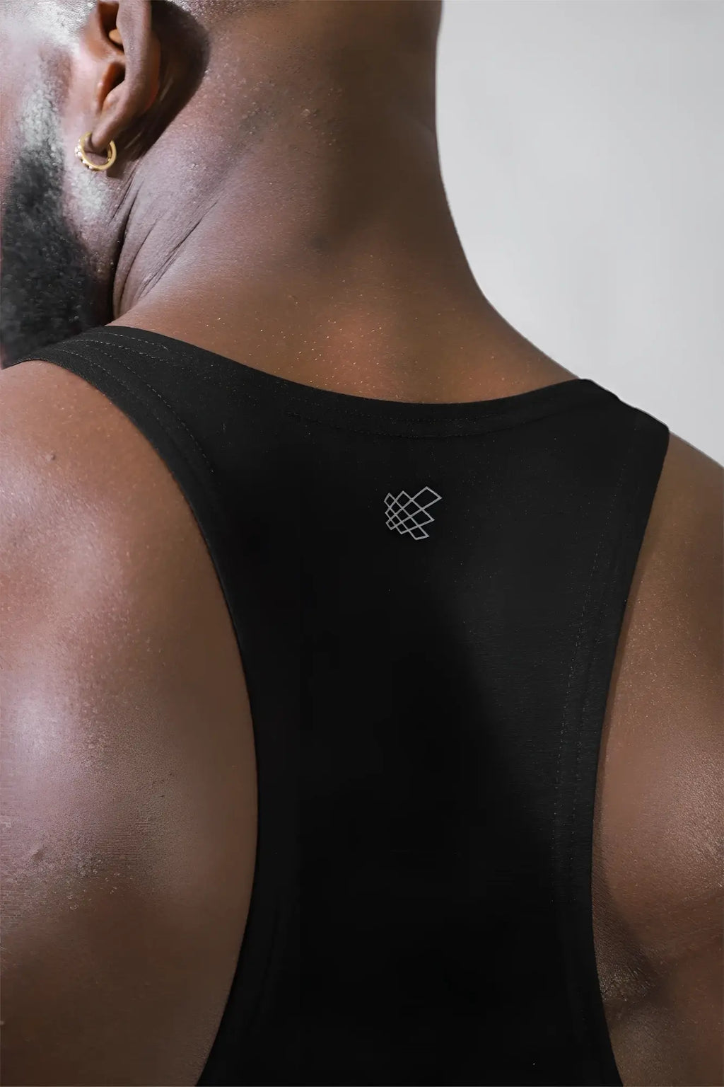 Back view of jed north classic bodybuilding racerback stringer premium black athletic tank top with white logo