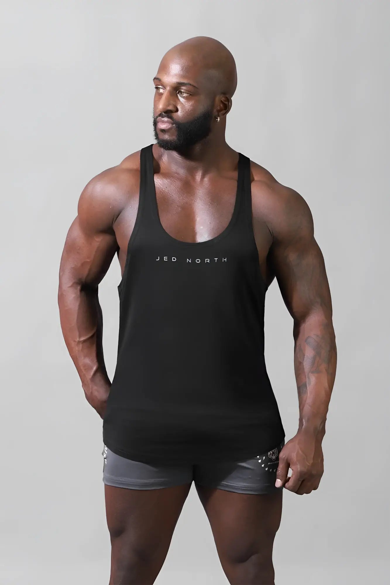 Black sleeveless premium cotton Jed North classic bodybuilding racerback stringer tank top with white logo print