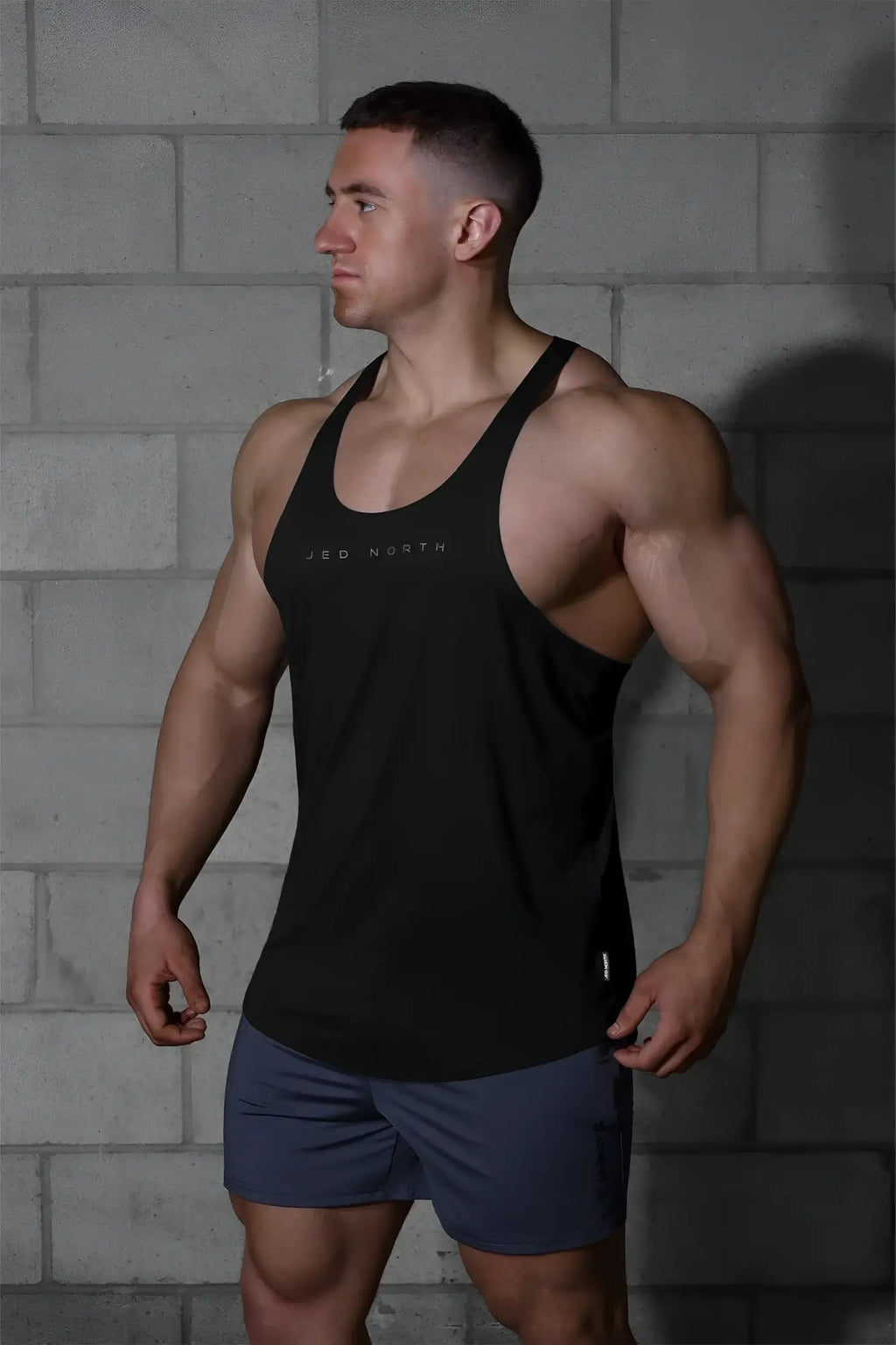 Black jed north classic bodybuilding racerback stringer tank top with white jbd north logo on chest premium material