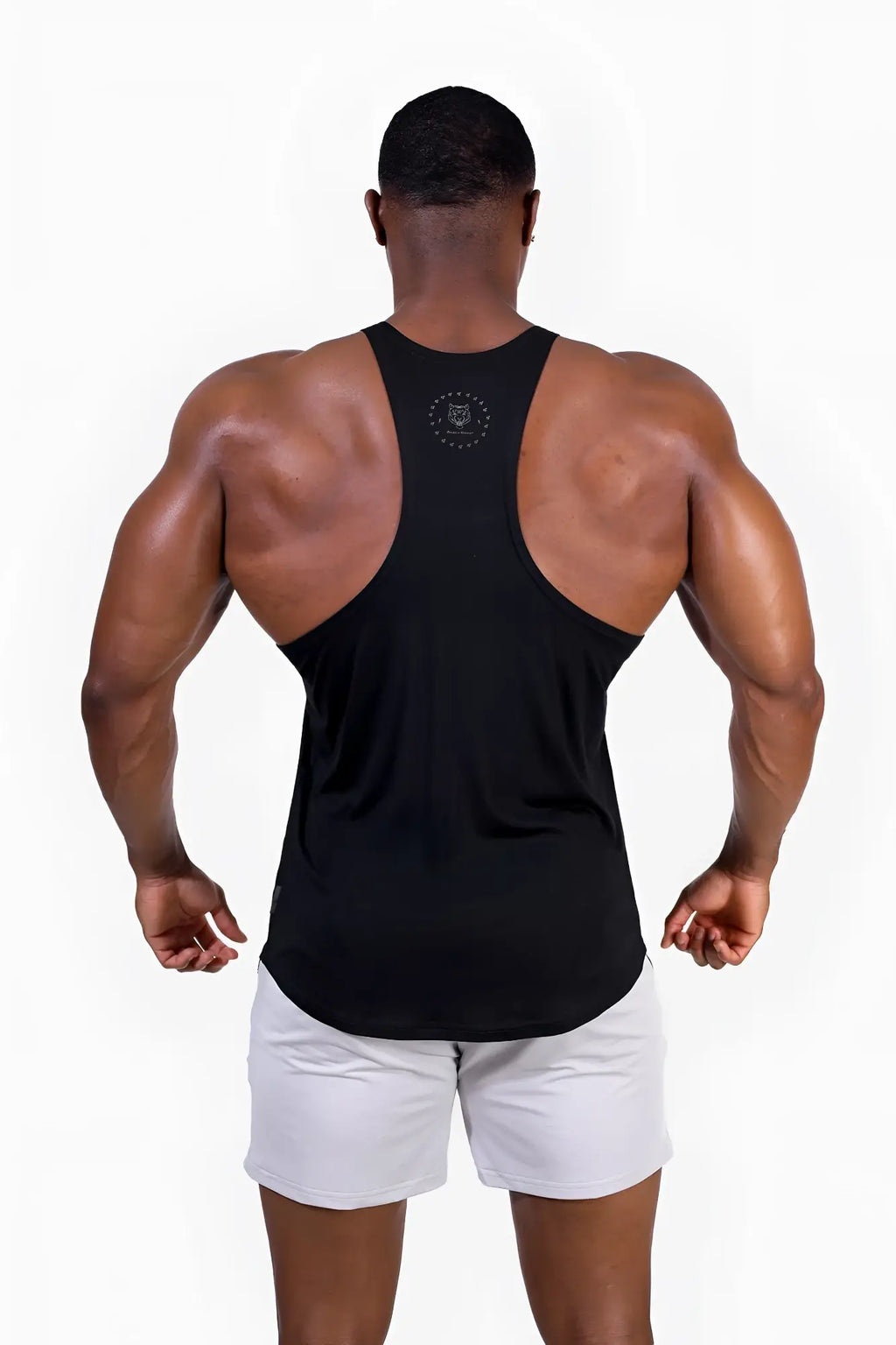 Back view of classic bodybuilding racerback stringer black muscle tank top with circular logo at the neck