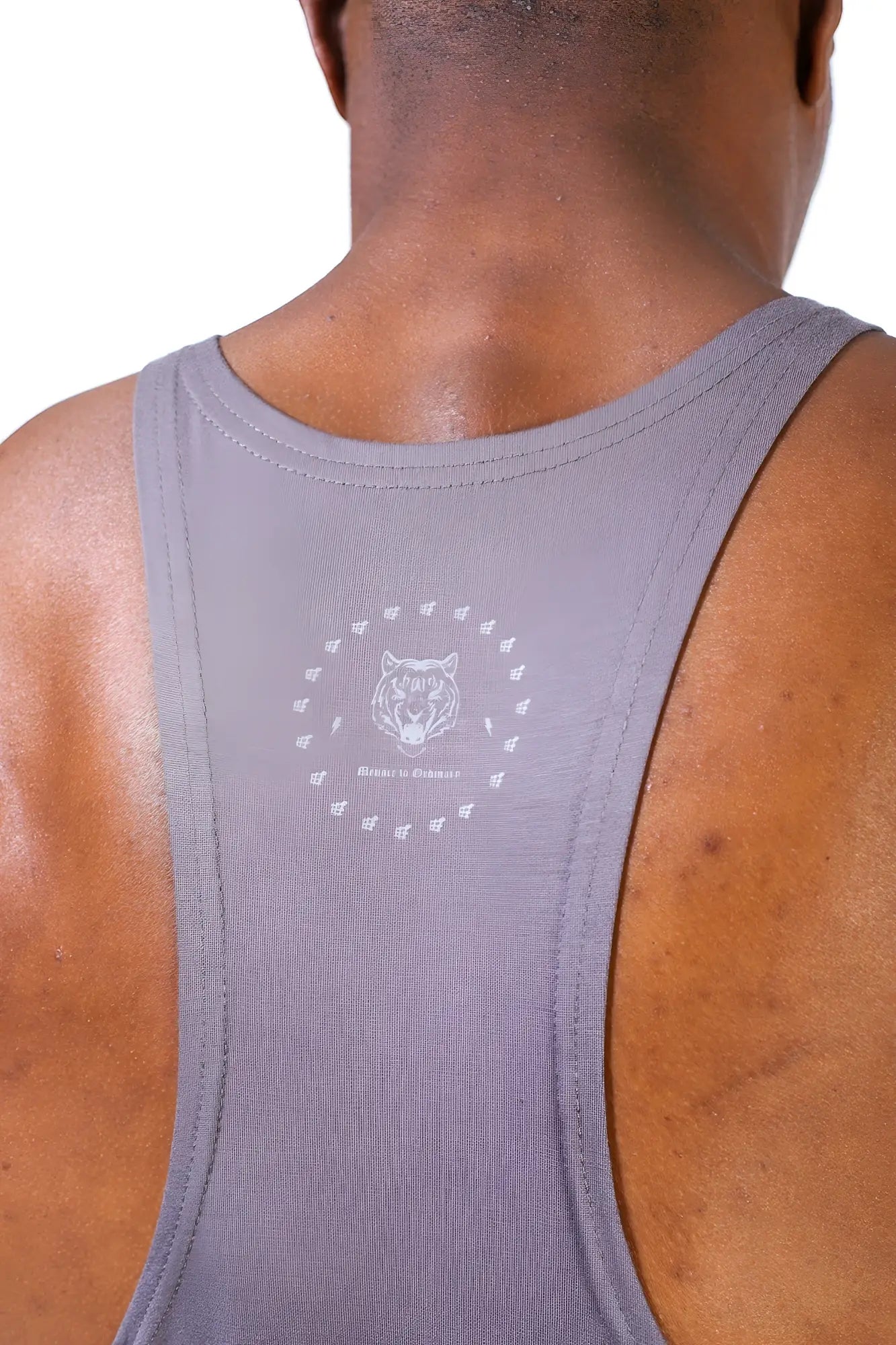 Back side of classic bodybuilding racerback stringer in gray with white tiger logo and hashtag pattern on the back