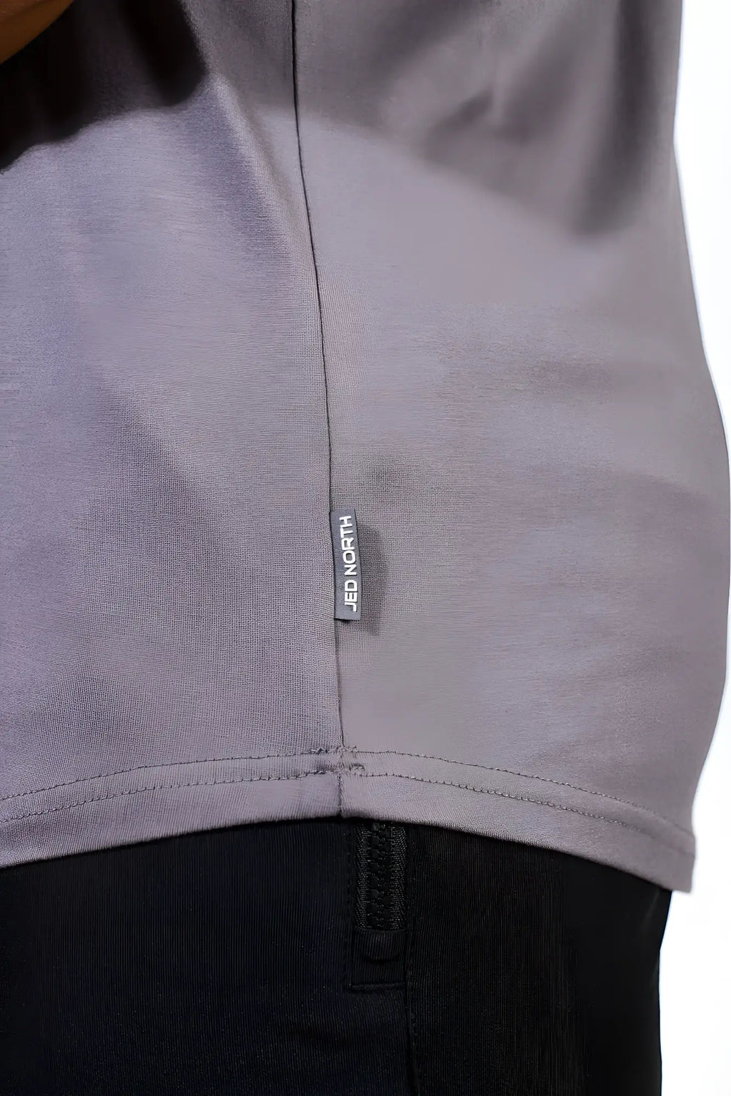 Gray heathered cotton classic bodybuilding racerback stringer t-shirt with black jed north brand tag along the seam