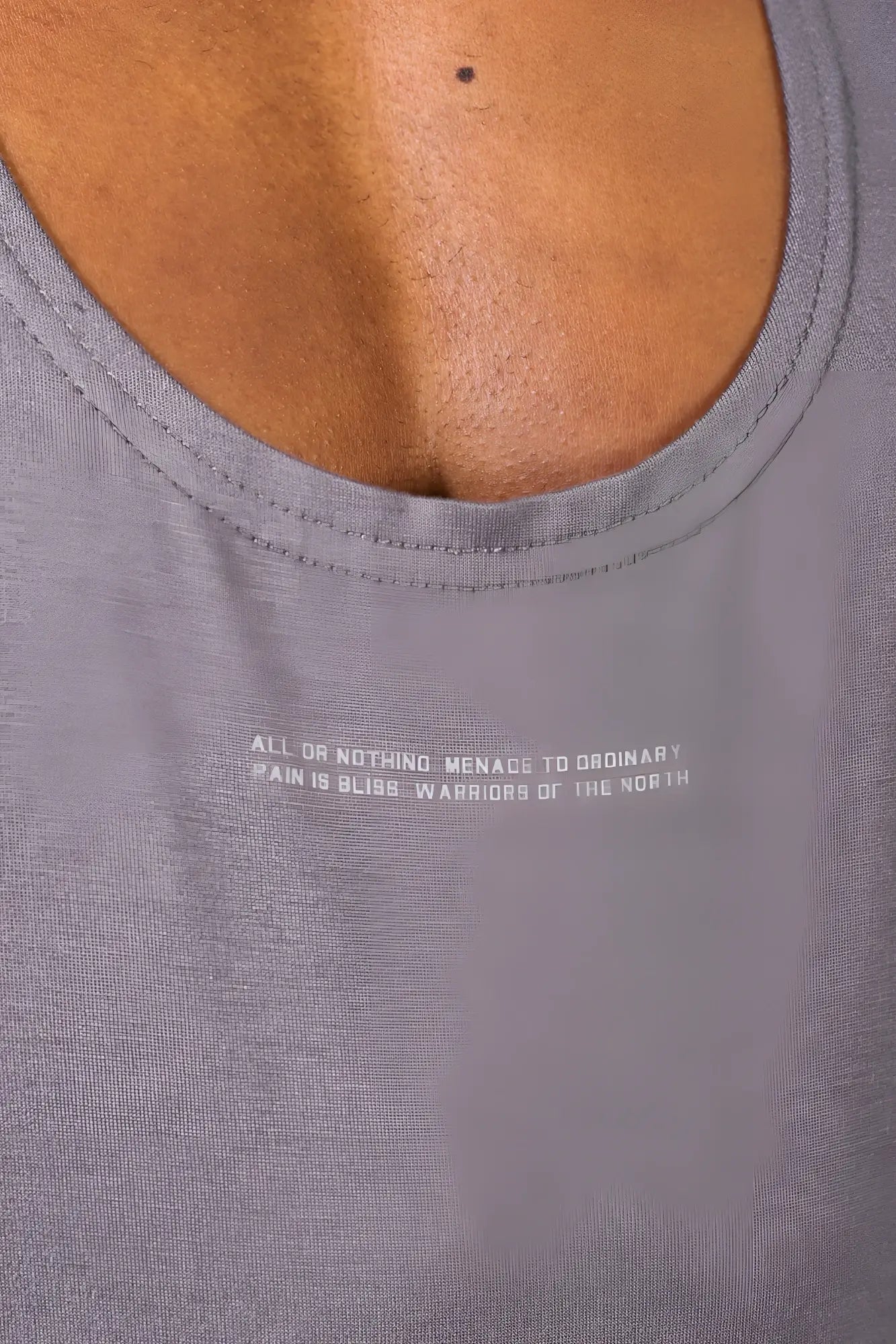 Gray heathered classic bodybuilding racerback stringer tank top with subtle white text print across the chest