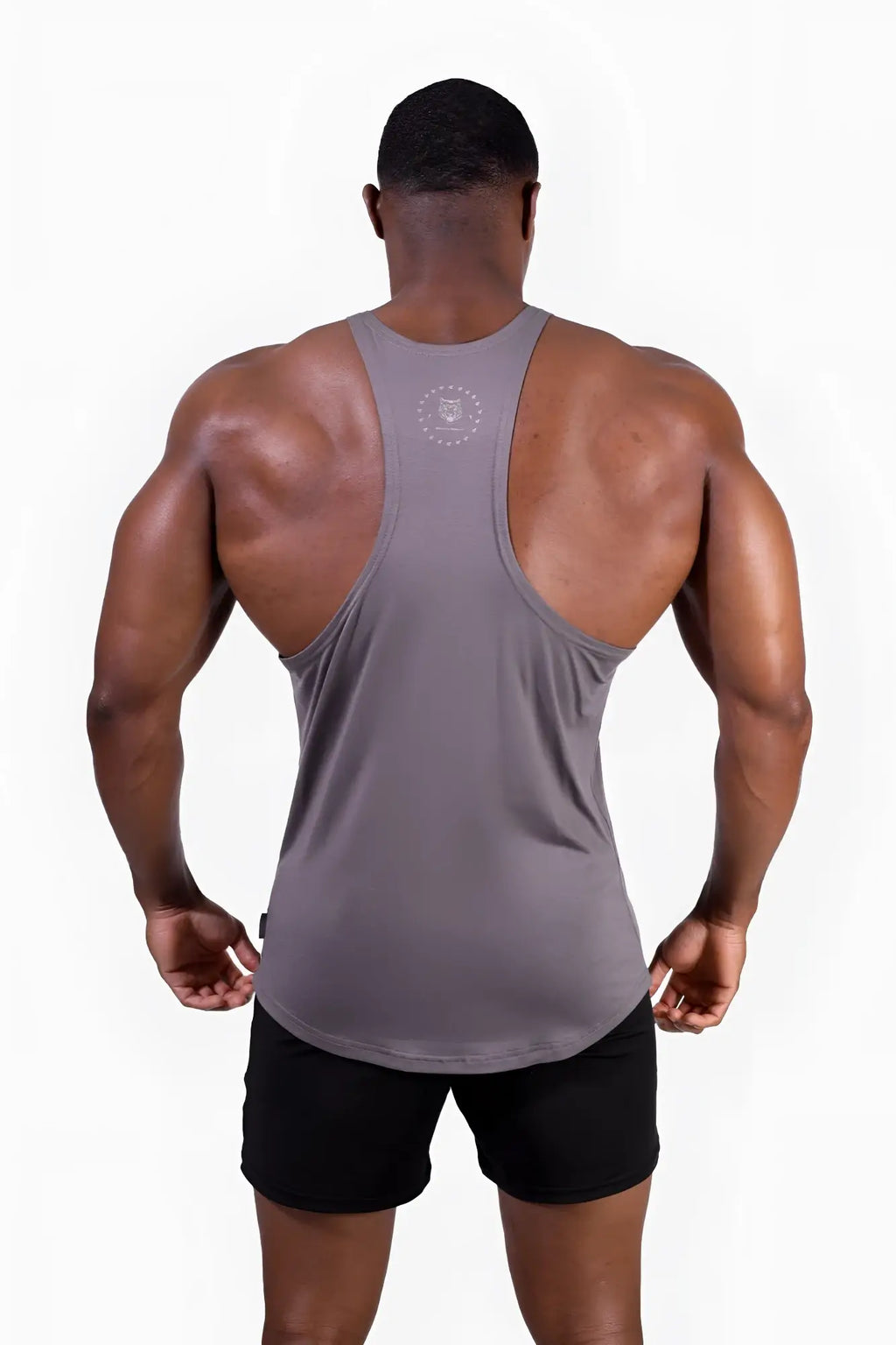 Back view of a gray classic bodybuilding racerback stringer muscle tank top with a subtle circular logo on the upper back