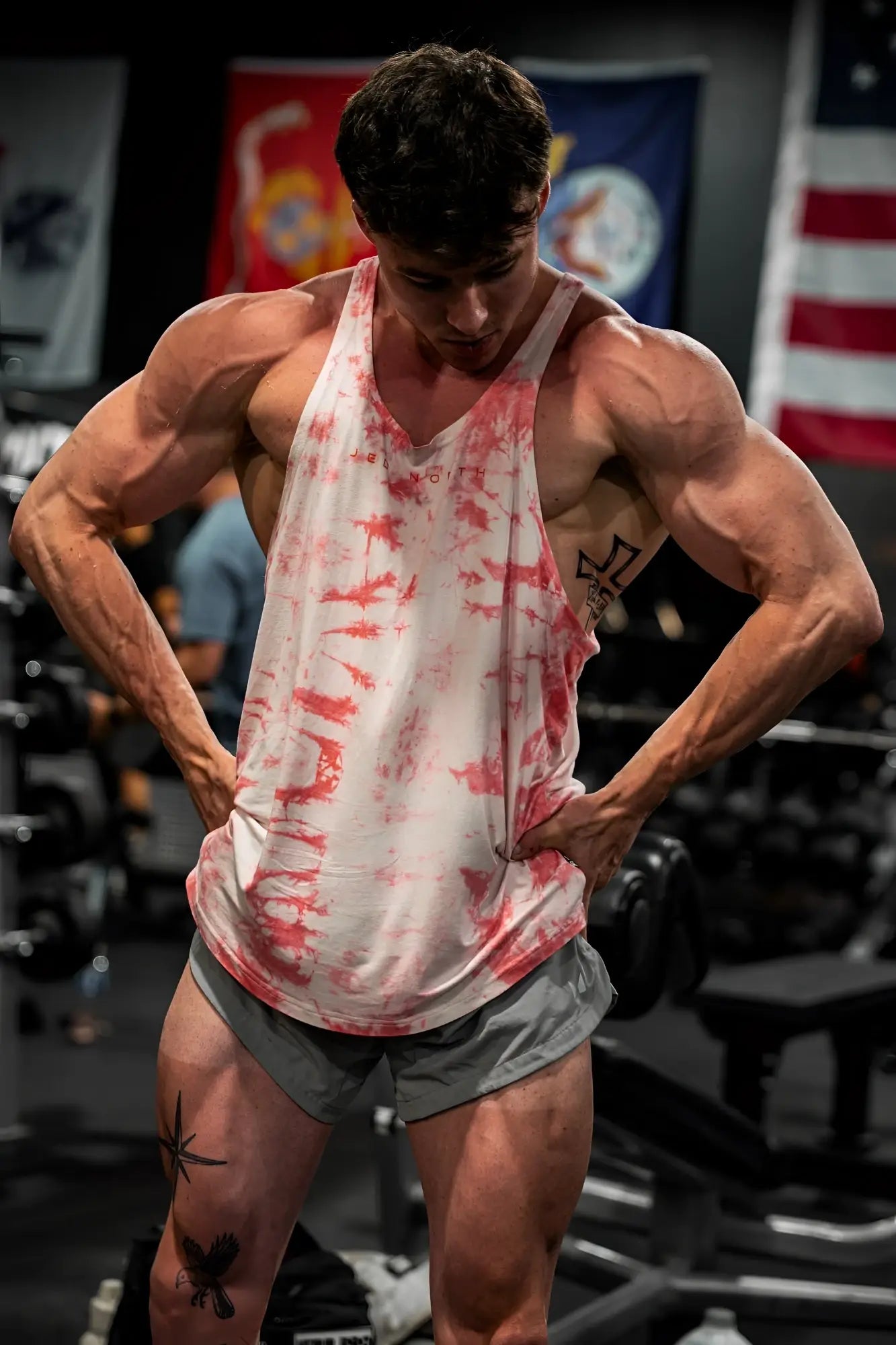Classic bodybuilding racerback stringer muscle tank top in white and red tie dye for gym and casual wear