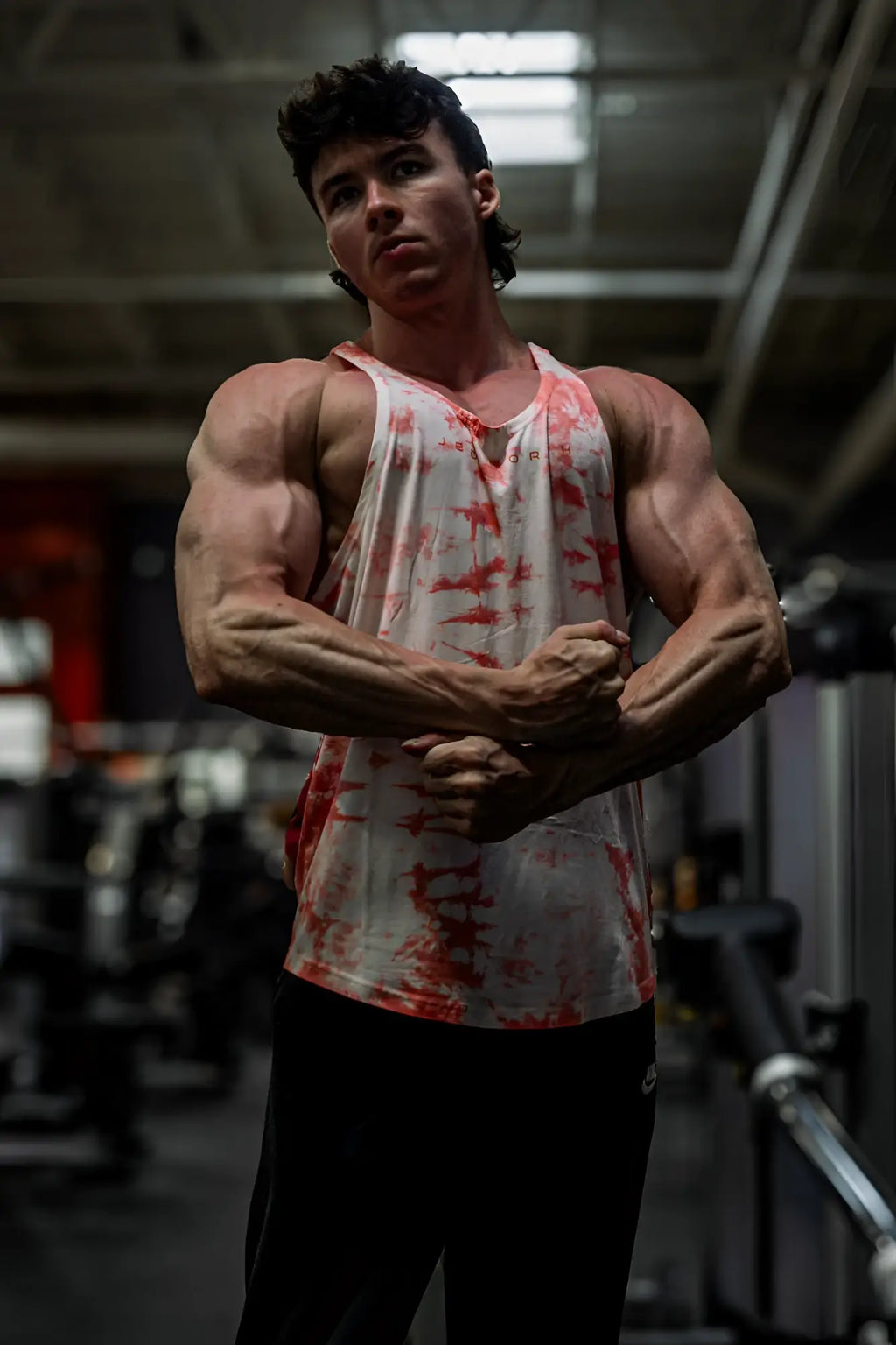 Classic bodybuilding racerback stringer tank top in white and red tie dye with muscle fit for gym workouts