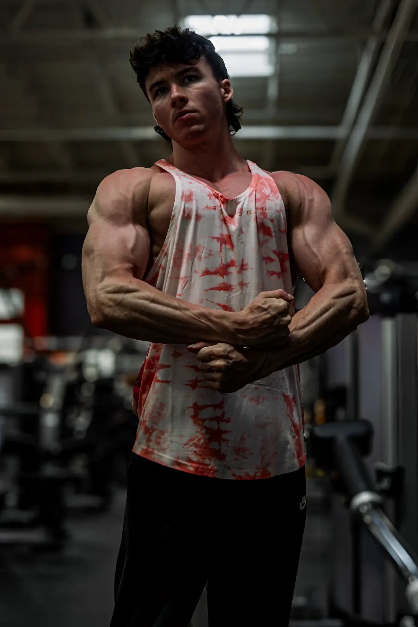 Classic bodybuilding racerback stringer tank top in white and red tie dye with muscle fit for gym workouts