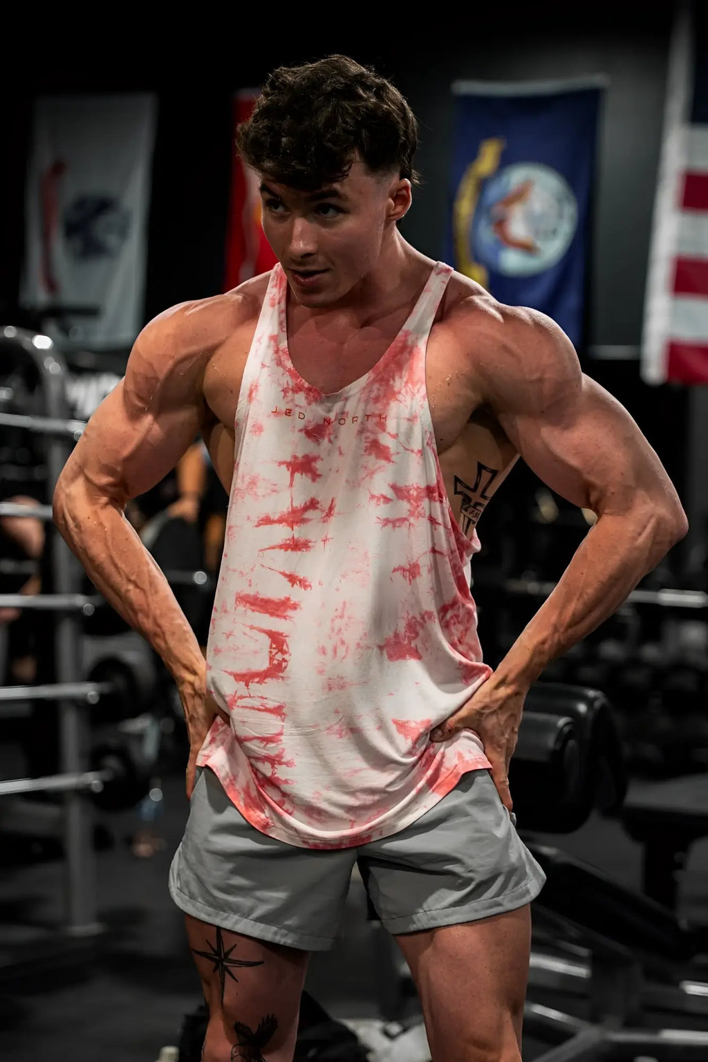 Classic bodybuilding racerback stringer muscle tank top in white and red tie dye for gym and workout use