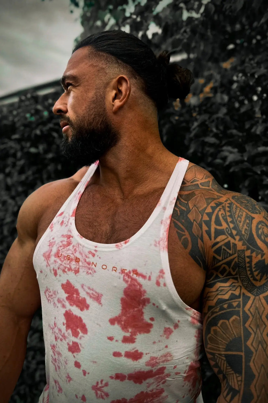 White tie dye tank top with red splatter and red north branding classic bodybuilding racerback stringer design